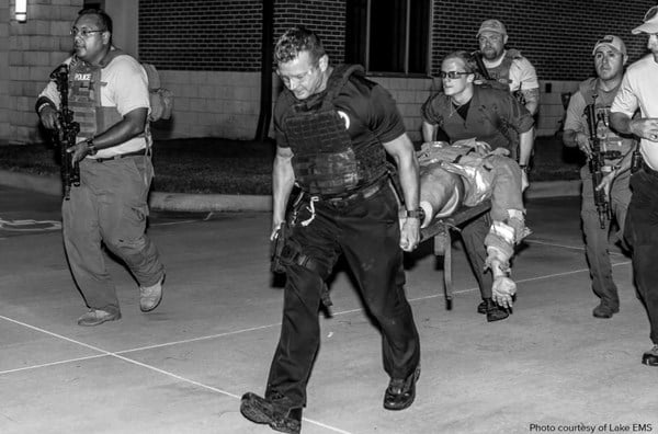 Evacuation of casualties from a secured scene with coordination between EMS and law enforcement teams.