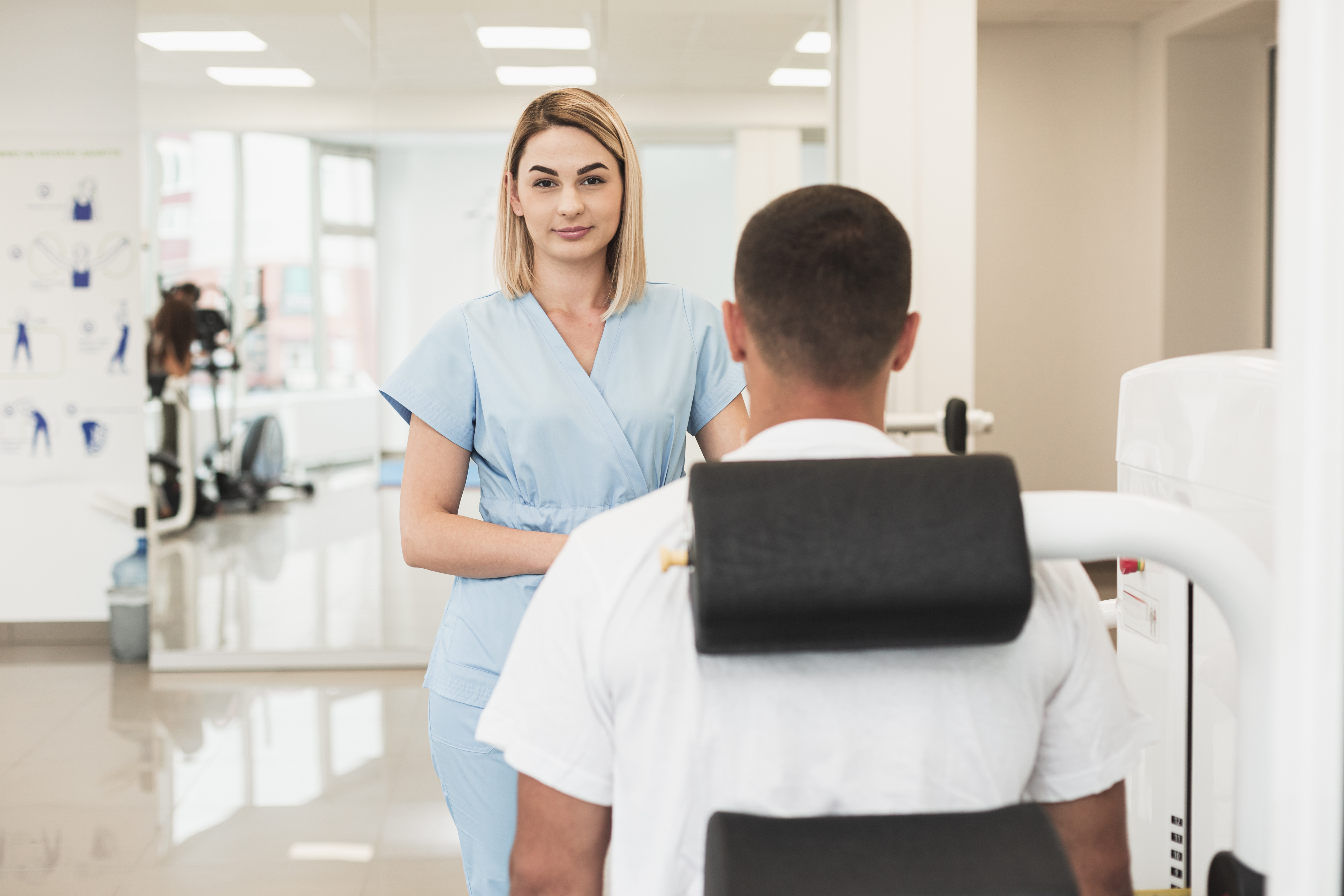 Blonde female doctor checking patient condition