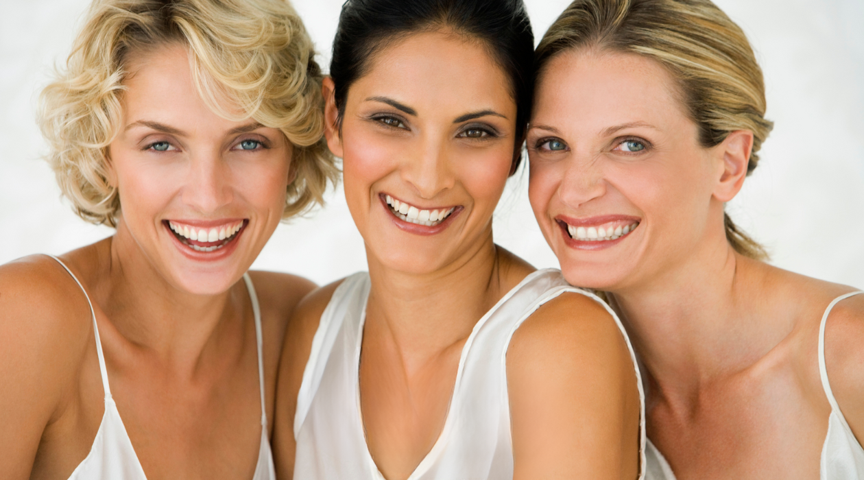 women smiling with bliss women smiling with bliss