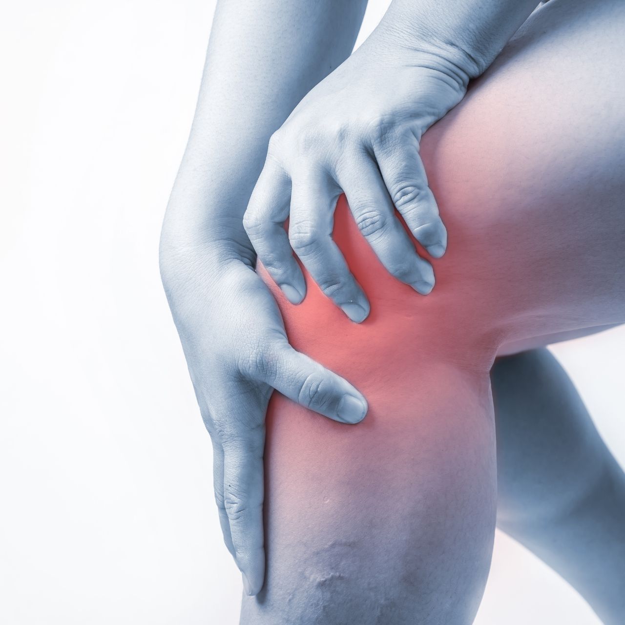 Close-up of a person holding their knee in pain, highlighted with a red glow to indicate joint discomfort or inflammation. The image represents knee pain, joint stress, or injury-related issues. Close-up of a person holding their knee in pain, highlighted with a red glow to indicate joint discomfort or inflammation. The image represents knee pain, joint stress, or injury-related issues.