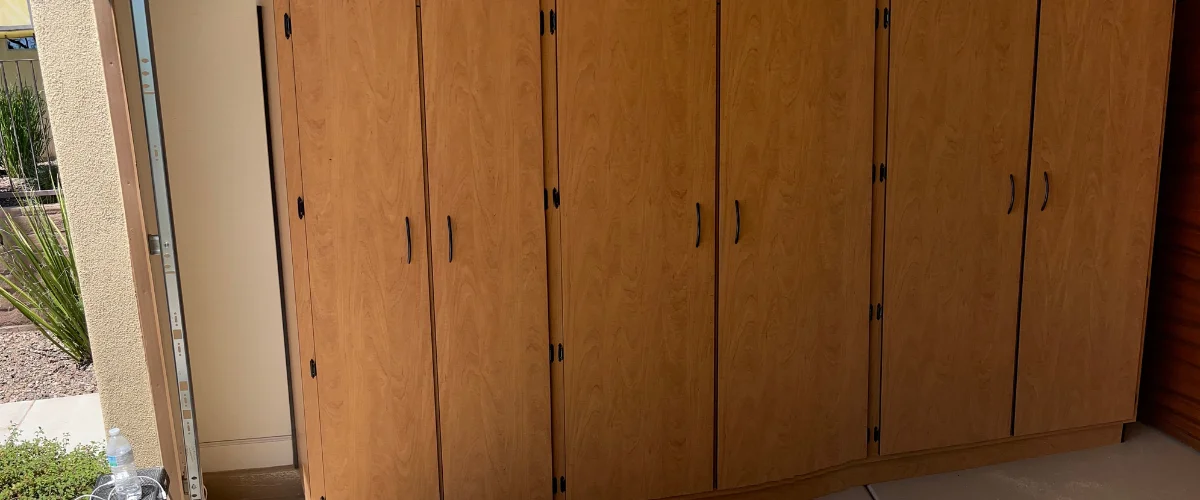 Wood finish garage storage cabinets with tall doors and modern handles for garage organization Wood finish garage storage cabinets with tall doors and modern handles for garage organization