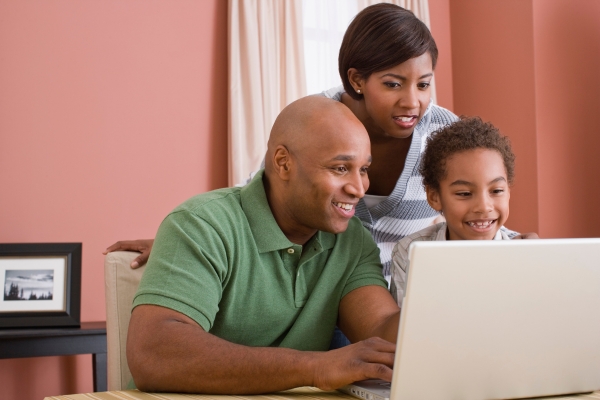 family watching from a laptop family watching from a laptop