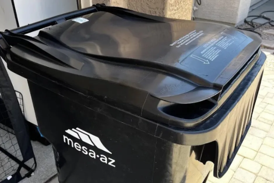 Cleaned black trash bin ready for use, showing a neat and tidy appearance Cleaned black trash bin ready for use, showing a neat and tidy appearance