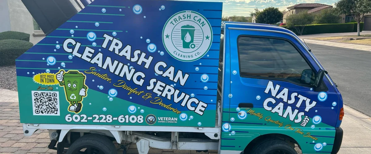 Branded trash can cleaning service truck with logo and contact information