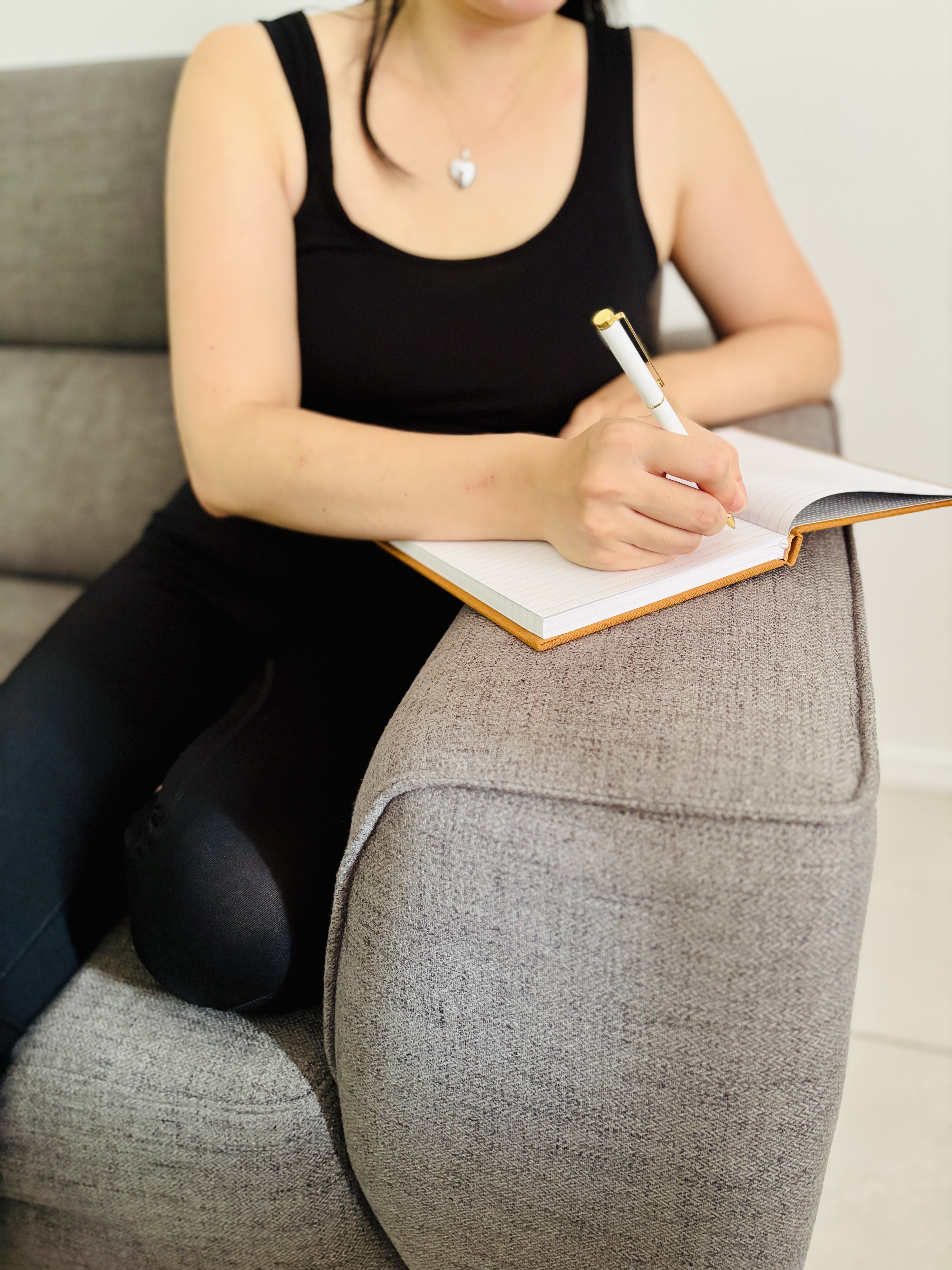 Someone writing in a journal