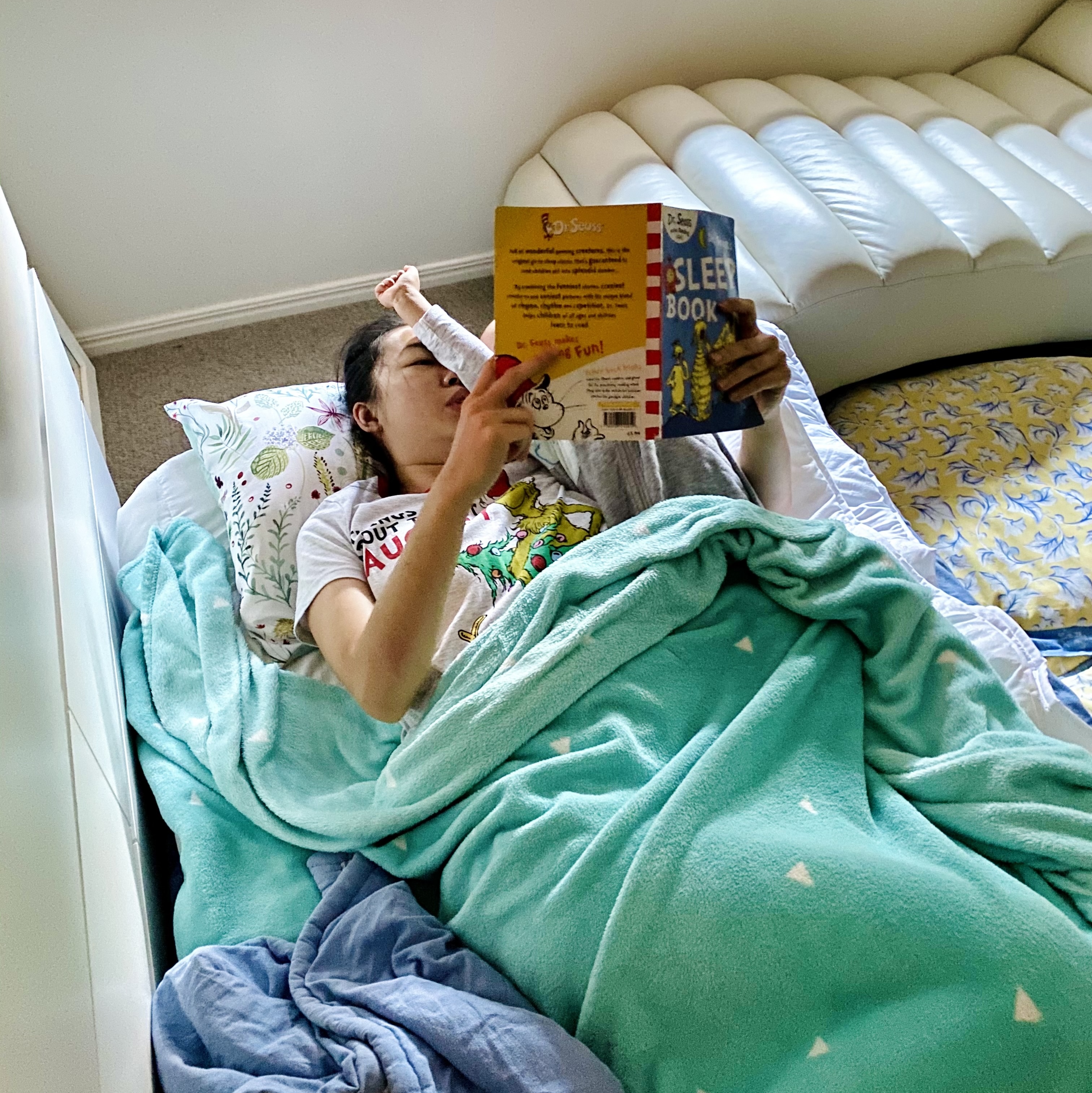 mum reading a book with her child mum reading a book with her child