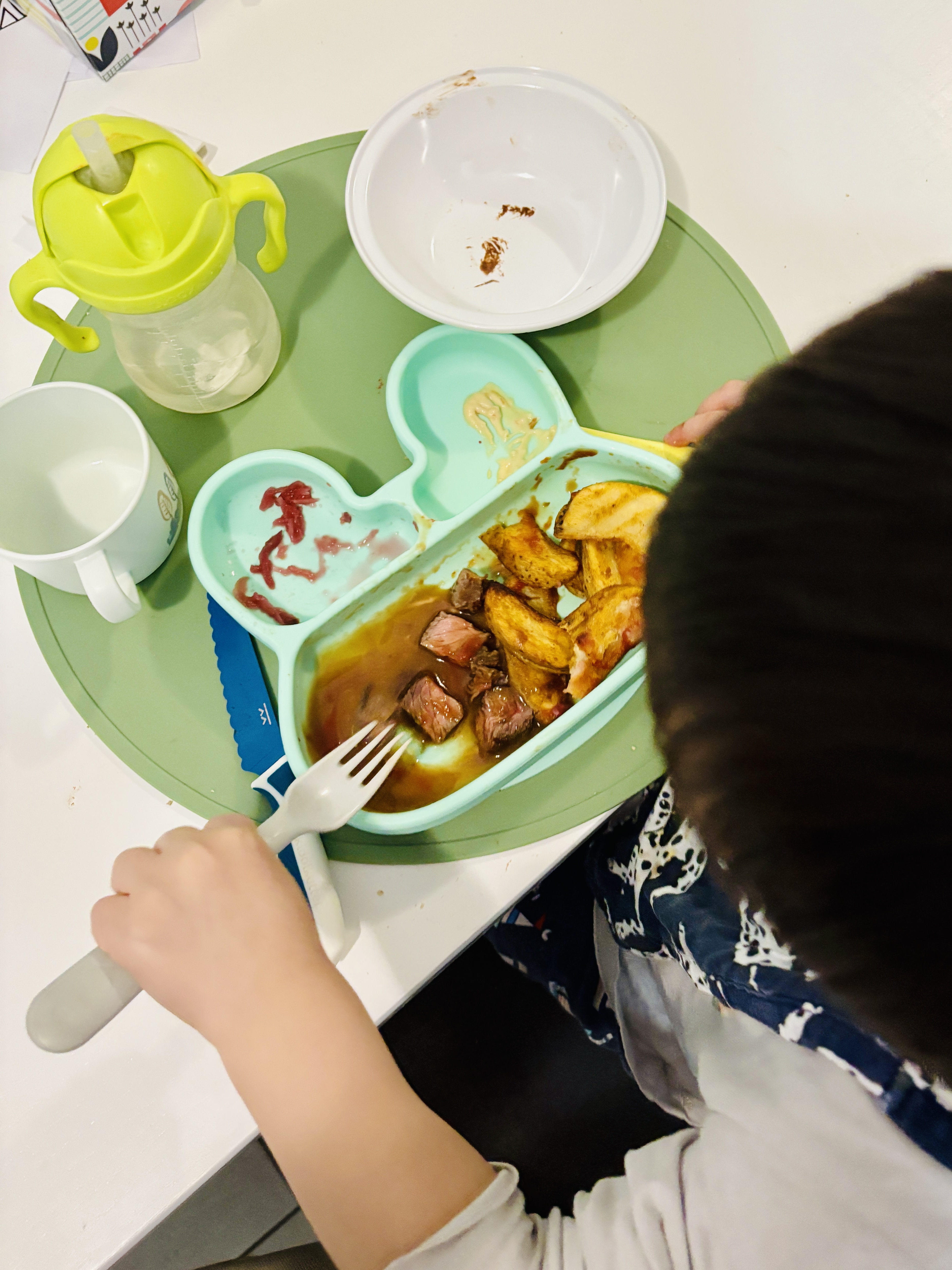 Child eating their dinner