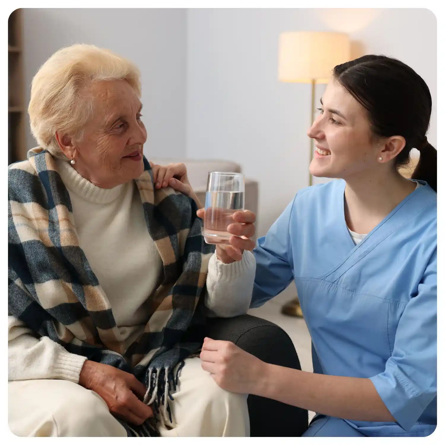 Companion caregiver enjoying meaningful conversation with senior during home care visit in Southern California