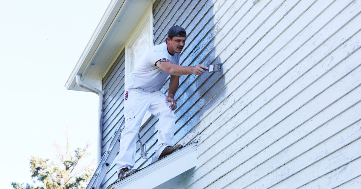 man painting exterior man painting exterior