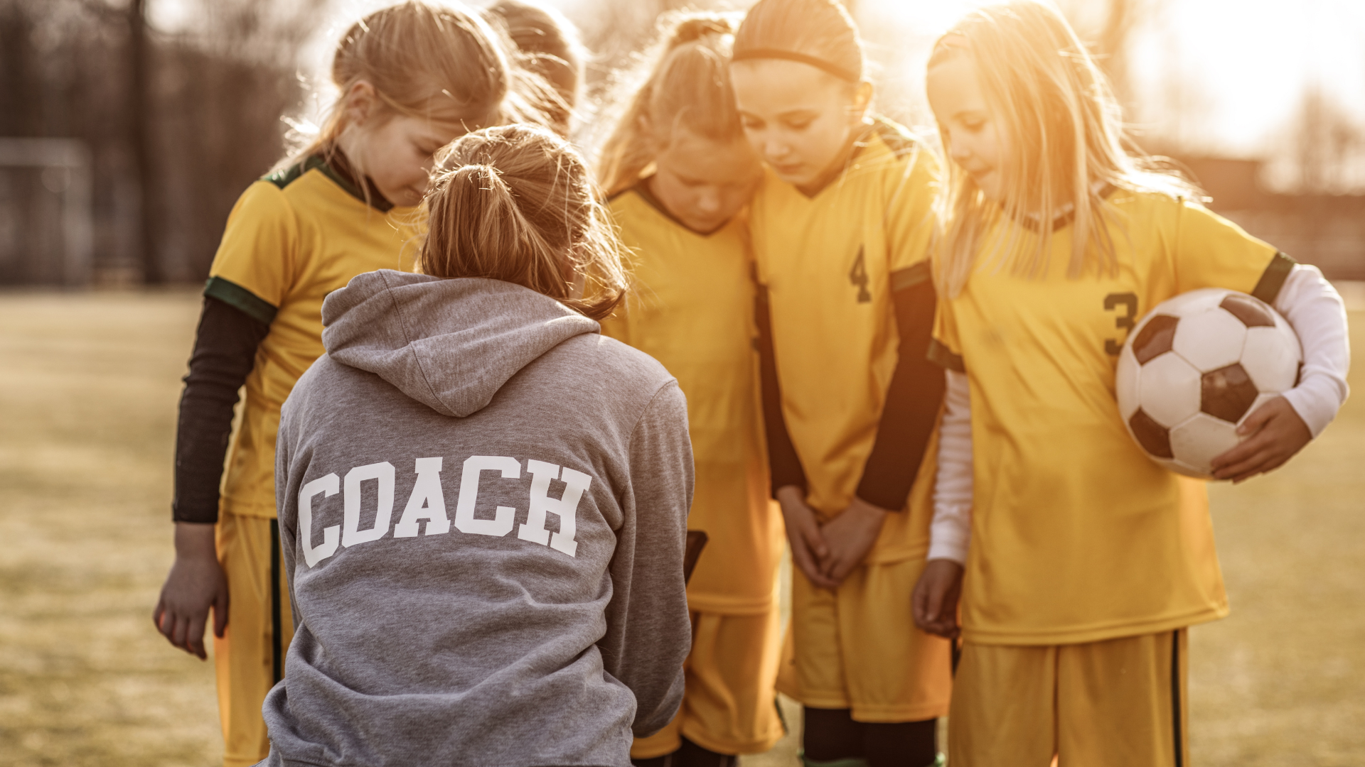 female coach with her team