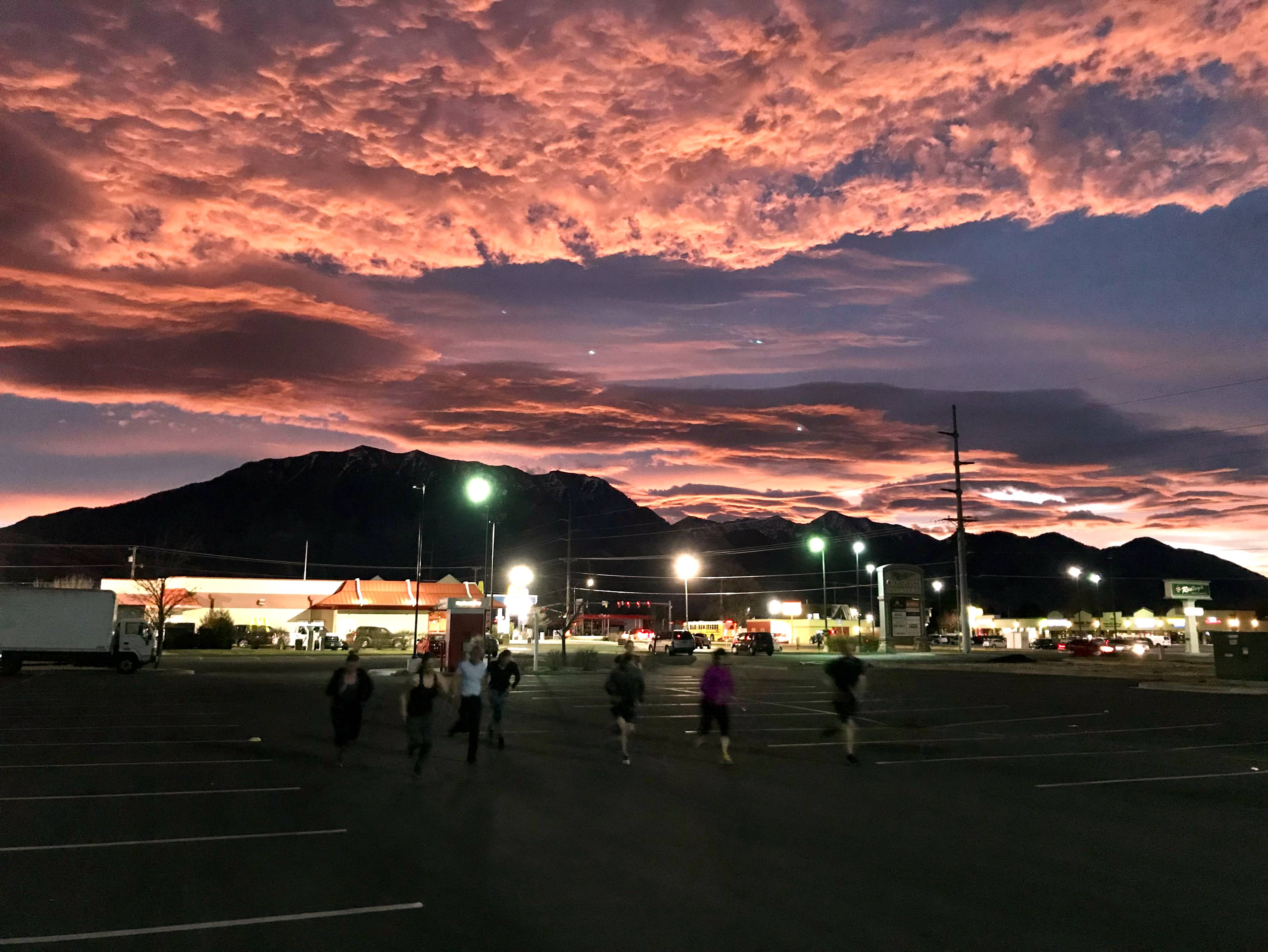 Outdoor fitness training at sunrise Orem gym - parking lot sprints with Mount Timpanogos view and dramatic Utah County morning sky Outdoor fitness training at sunrise Orem gym - parking lot sprints with Mount Timpanogos view and dramatic Utah County morning sky