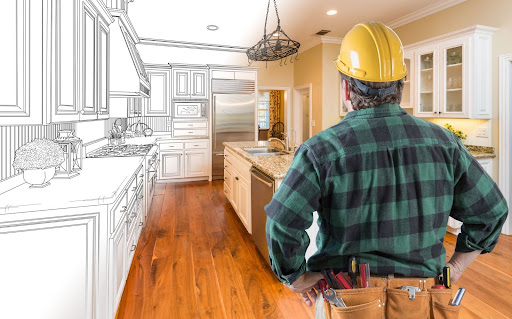 A carpenter staring at the whole kitchen