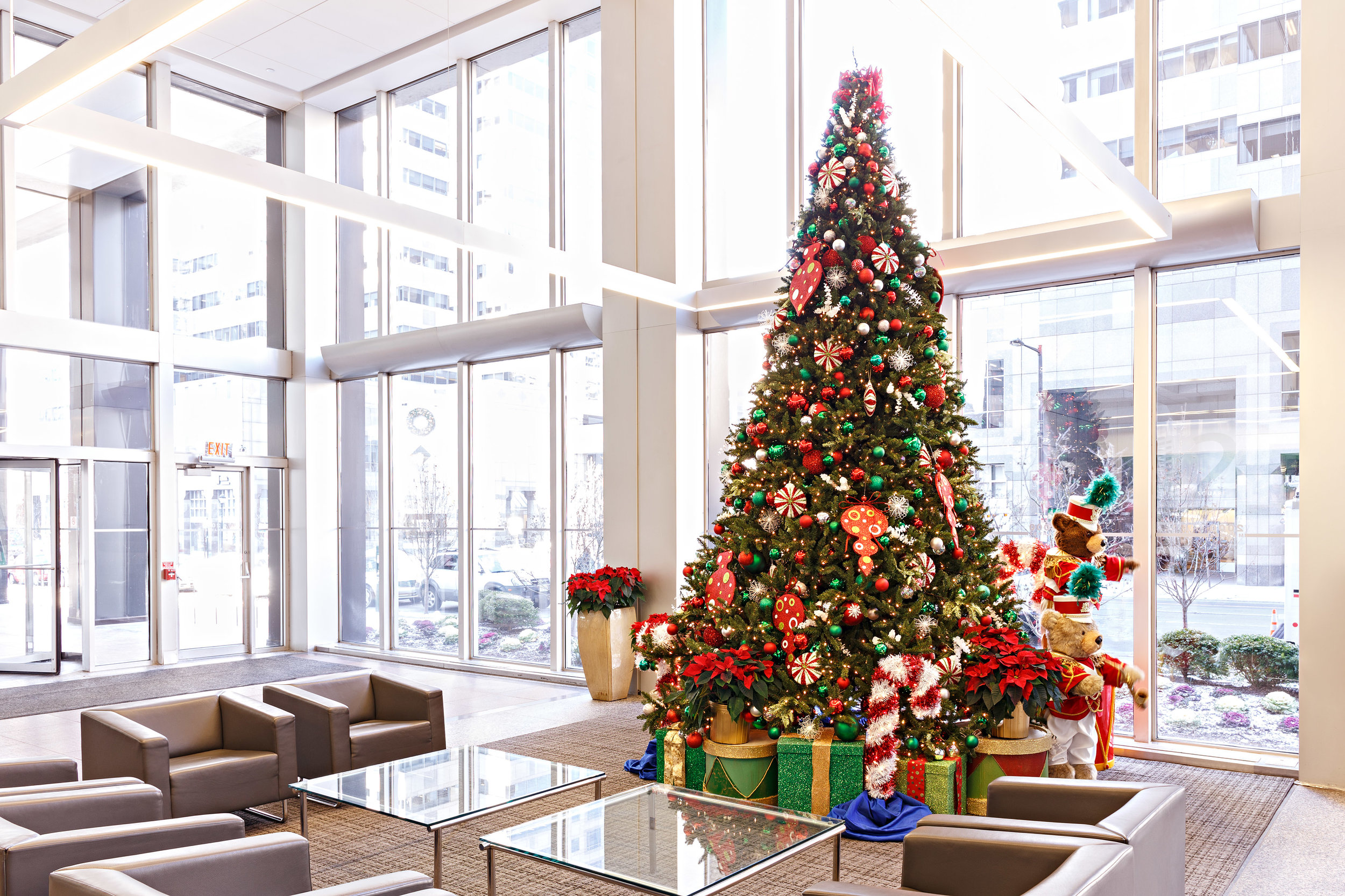 Fully decorated artificial Christmas tree with green and red ornaments