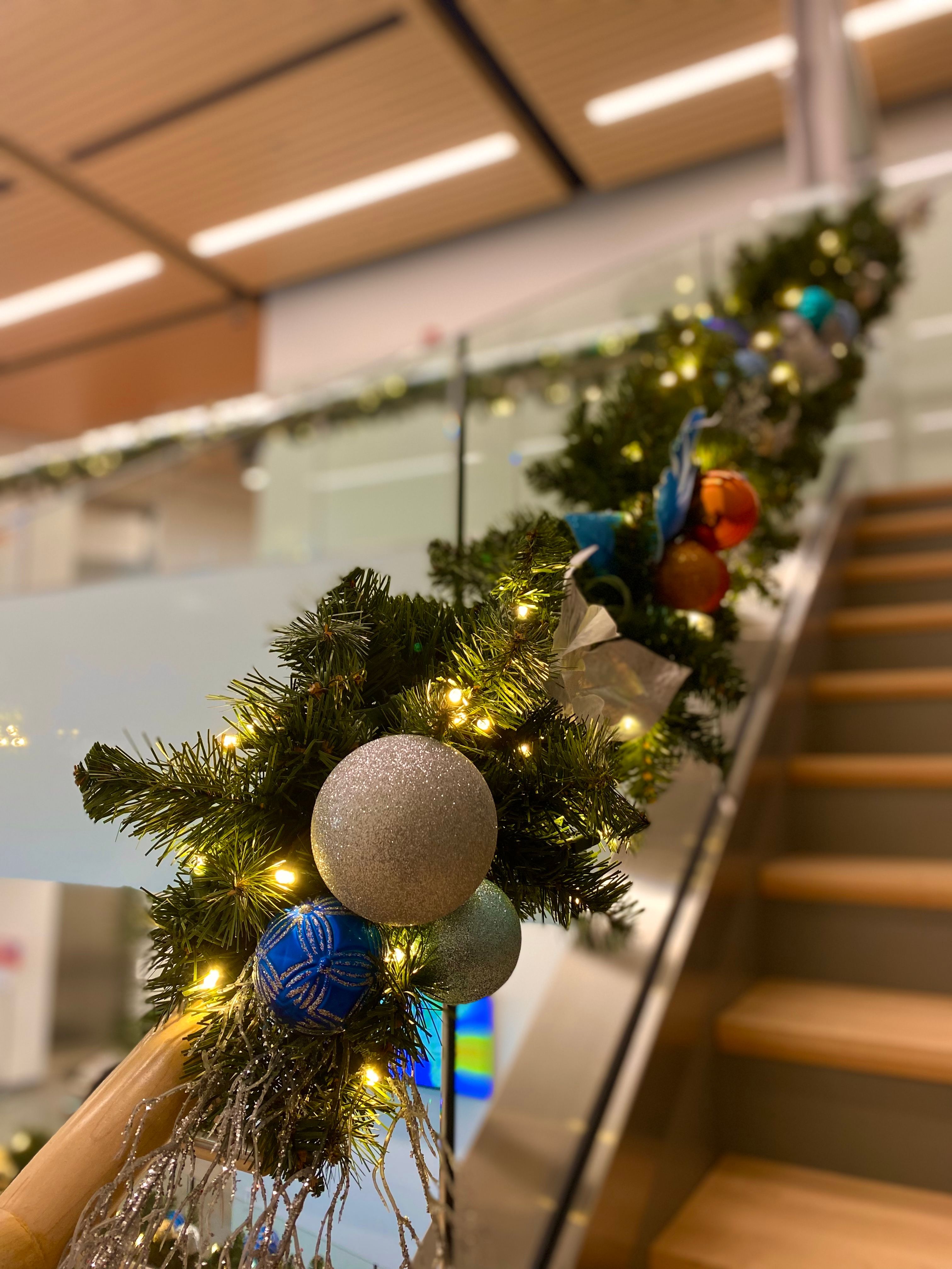 Seasonal floral arrangements and lights designed by Brew City Botanicals