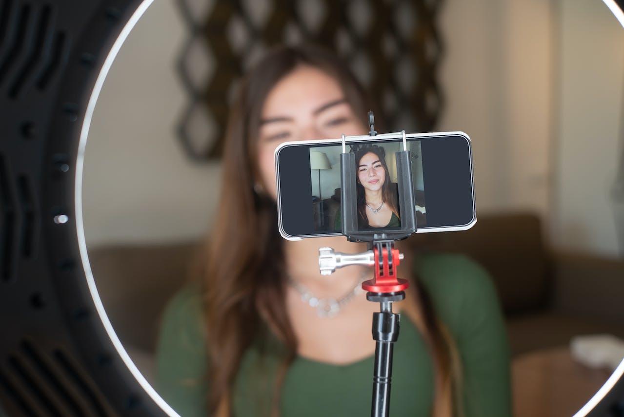 Woman recording video of herself Woman recording video of herself