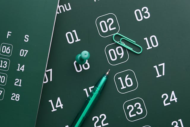 Calendar numbers scattered with green pen representing time periods and key components of time value of money for Australian financial planning
