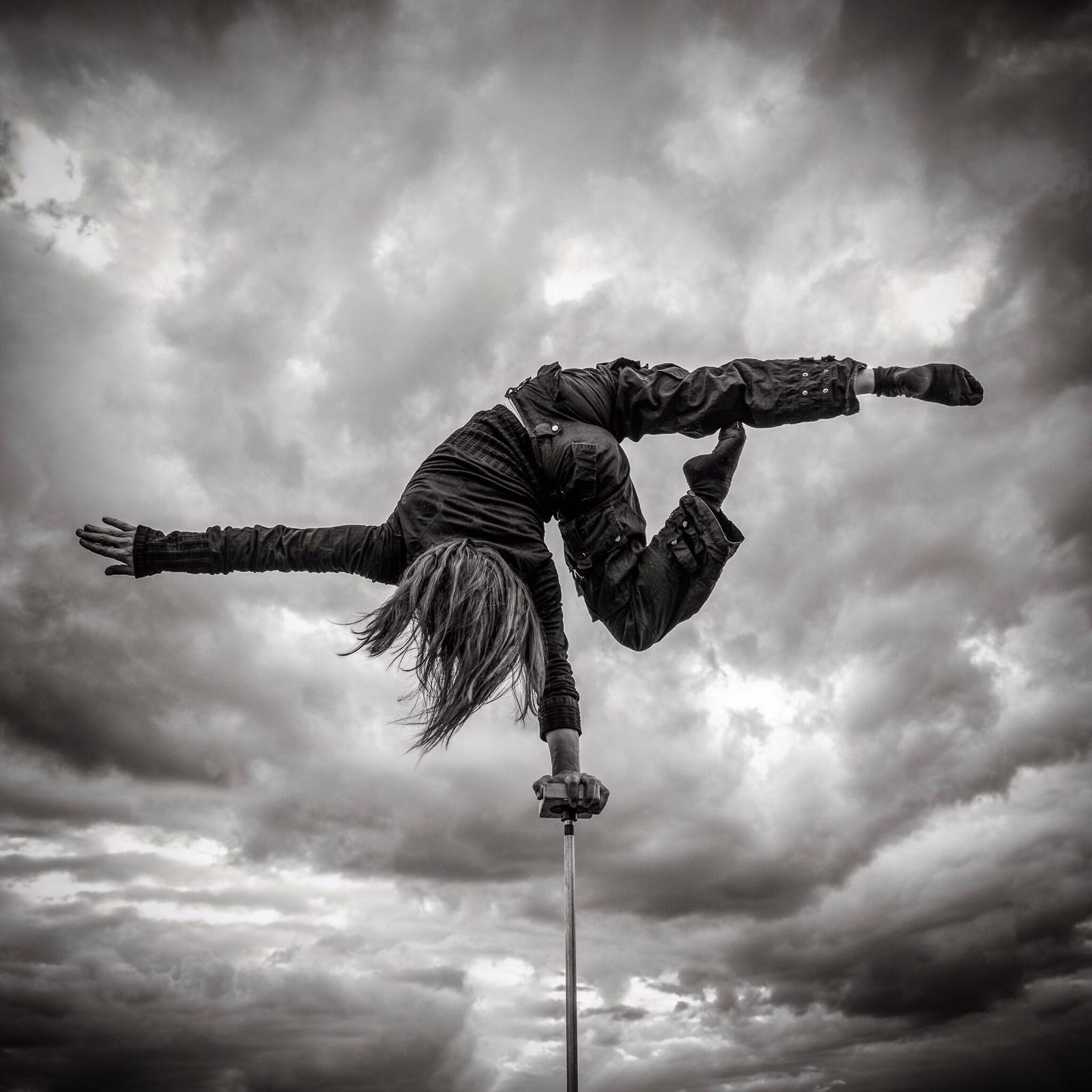 Against a dark and stormy sky, instructor Tamzen Moulding demonstrates the kind of one-arm handstand that she will teach in her workshops on October 26th Against a dark and stormy sky, instructor Tamzen Moulding demonstrates the kind of one-arm handstand that she will teach in her workshops on October 26th