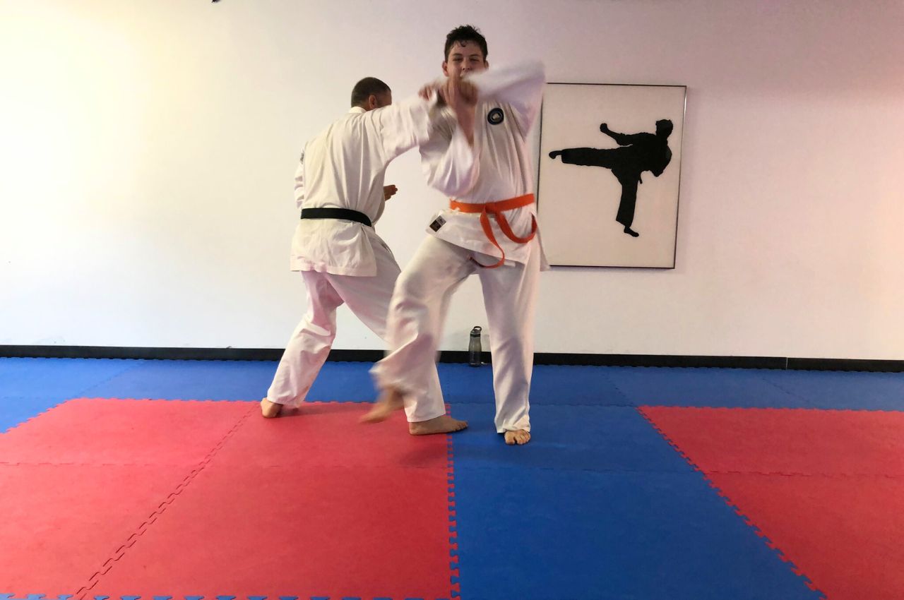 Martial arts instructor with kids
