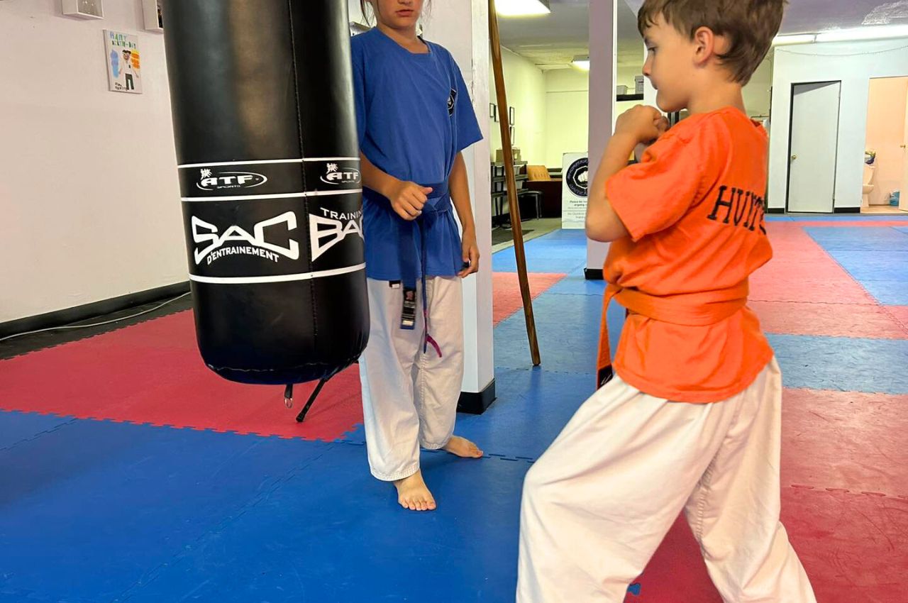 Martial arts instructor with kids