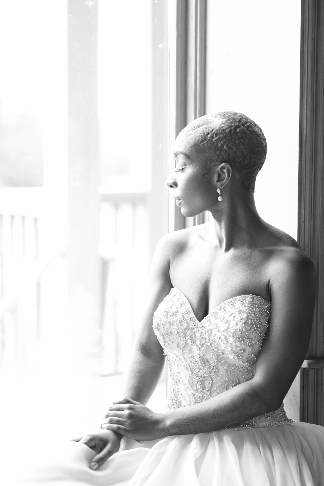 bride sitting by window meditating bride sitting by window meditating