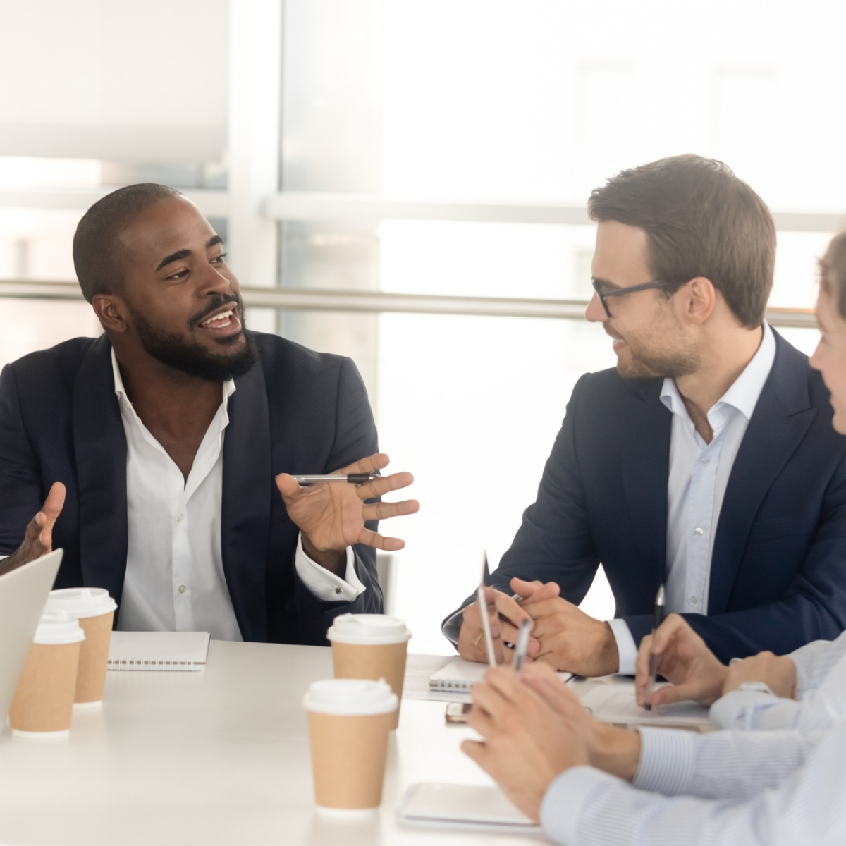 Group of staff members laugh at a post made on behalf of company Group of staff members laugh at a post made on behalf of company