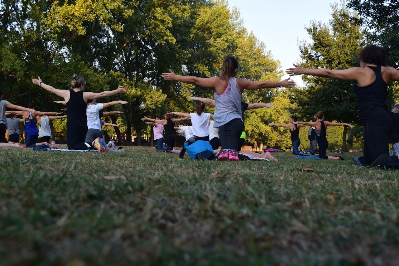 Group yoga in an open space Group yoga in an open space