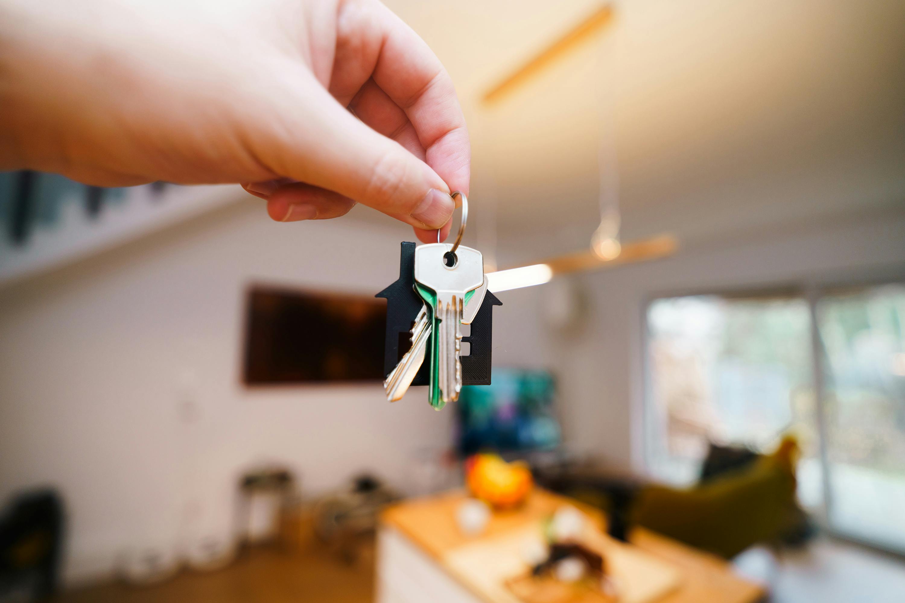 Investor negotiating a creative financing deal directly with a property seller at a table with paperwork. Investor negotiating a creative financing deal directly with a property seller at a table with paperwork.