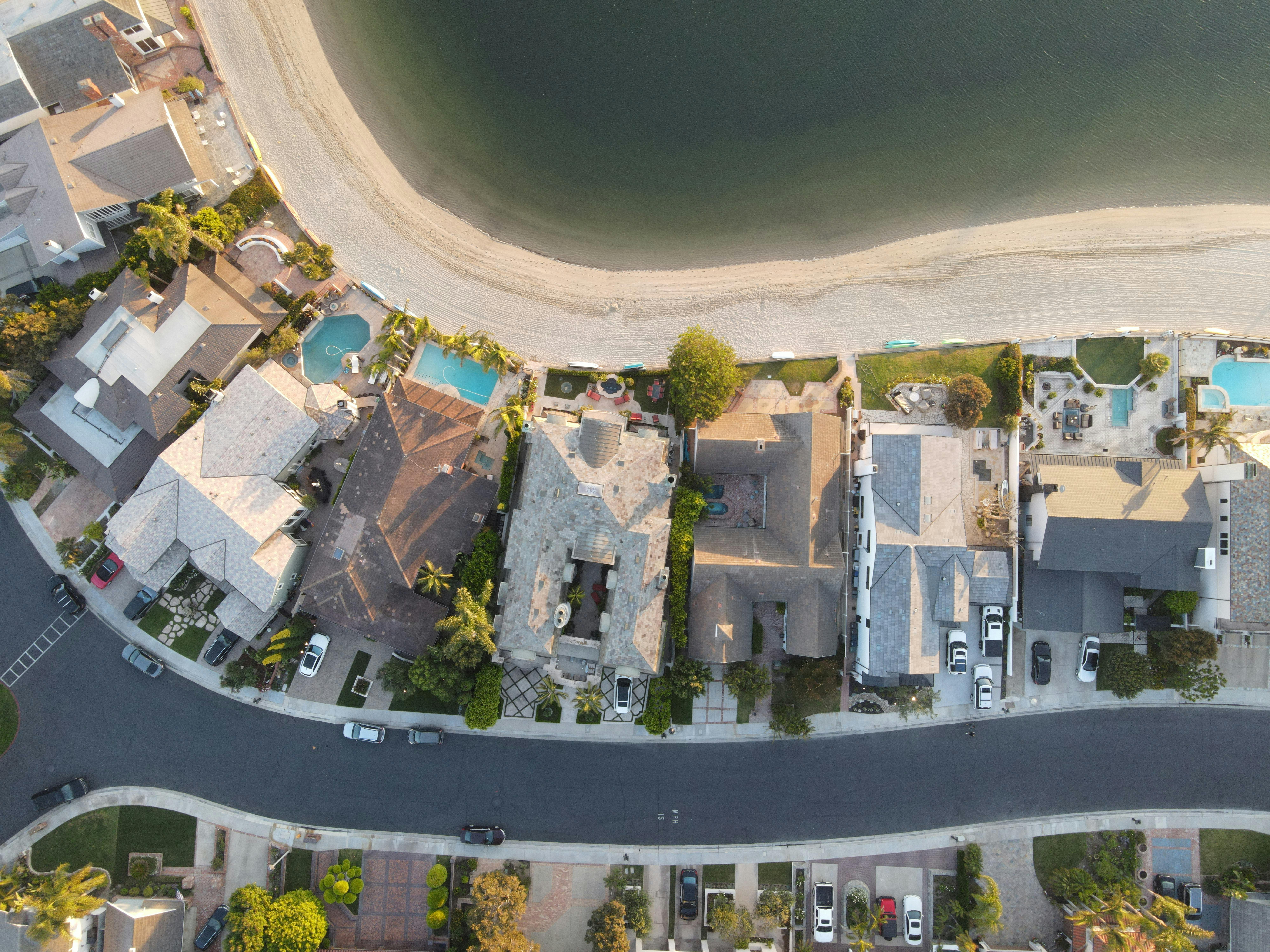 Real estate investor reviewing a modest property, symbolizing how small first deals can build momentum and confidence in real estate investing. Real estate investor reviewing a modest property, symbolizing how small first deals can build momentum and confidence in real estate investing.