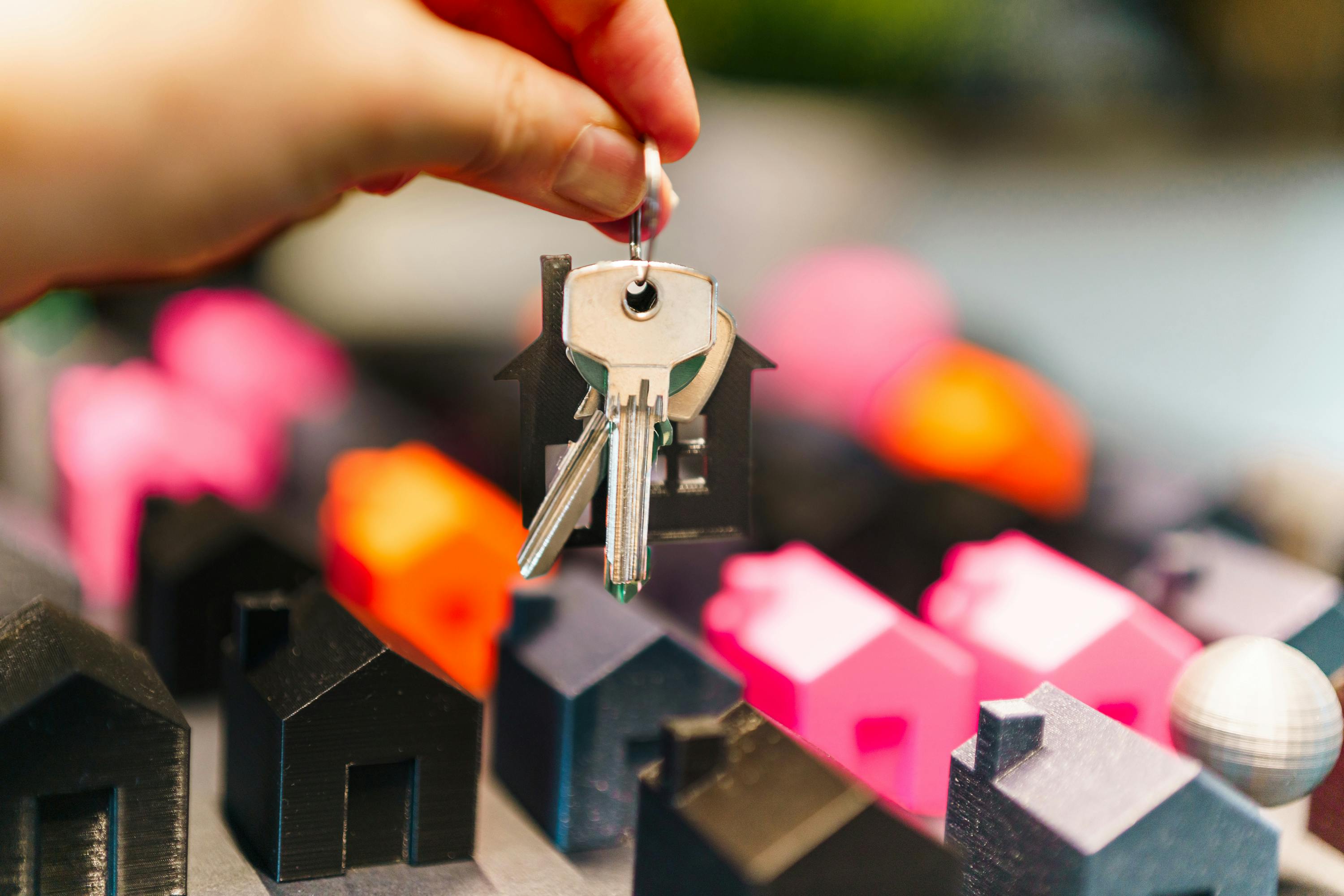 A confident investor holding property keys, symbolizing perseverance, growth, and success in real estate investing. A confident investor holding property keys, symbolizing perseverance, growth, and success in real estate investing.