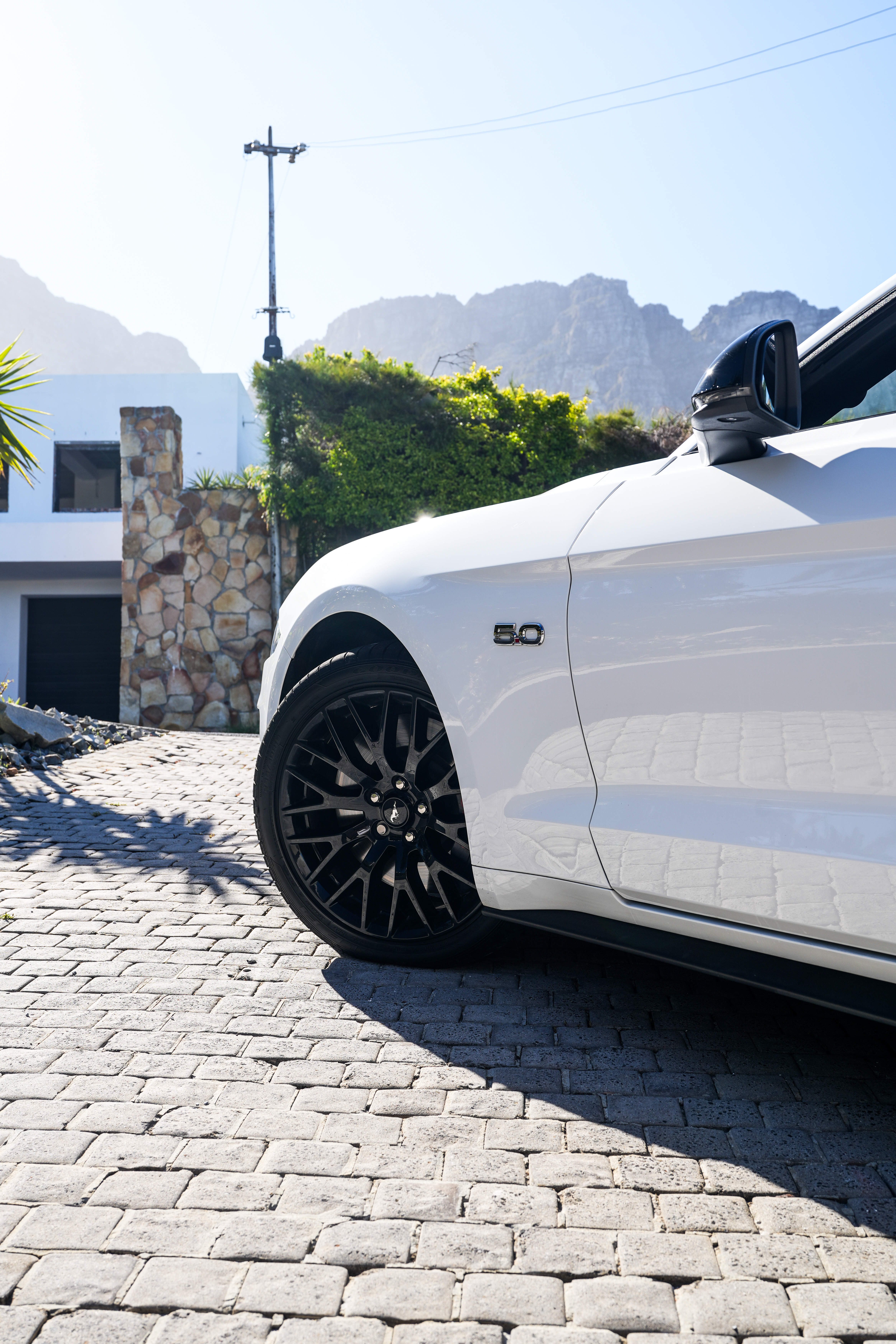 White 2021 Ford Mustang GT front angle.