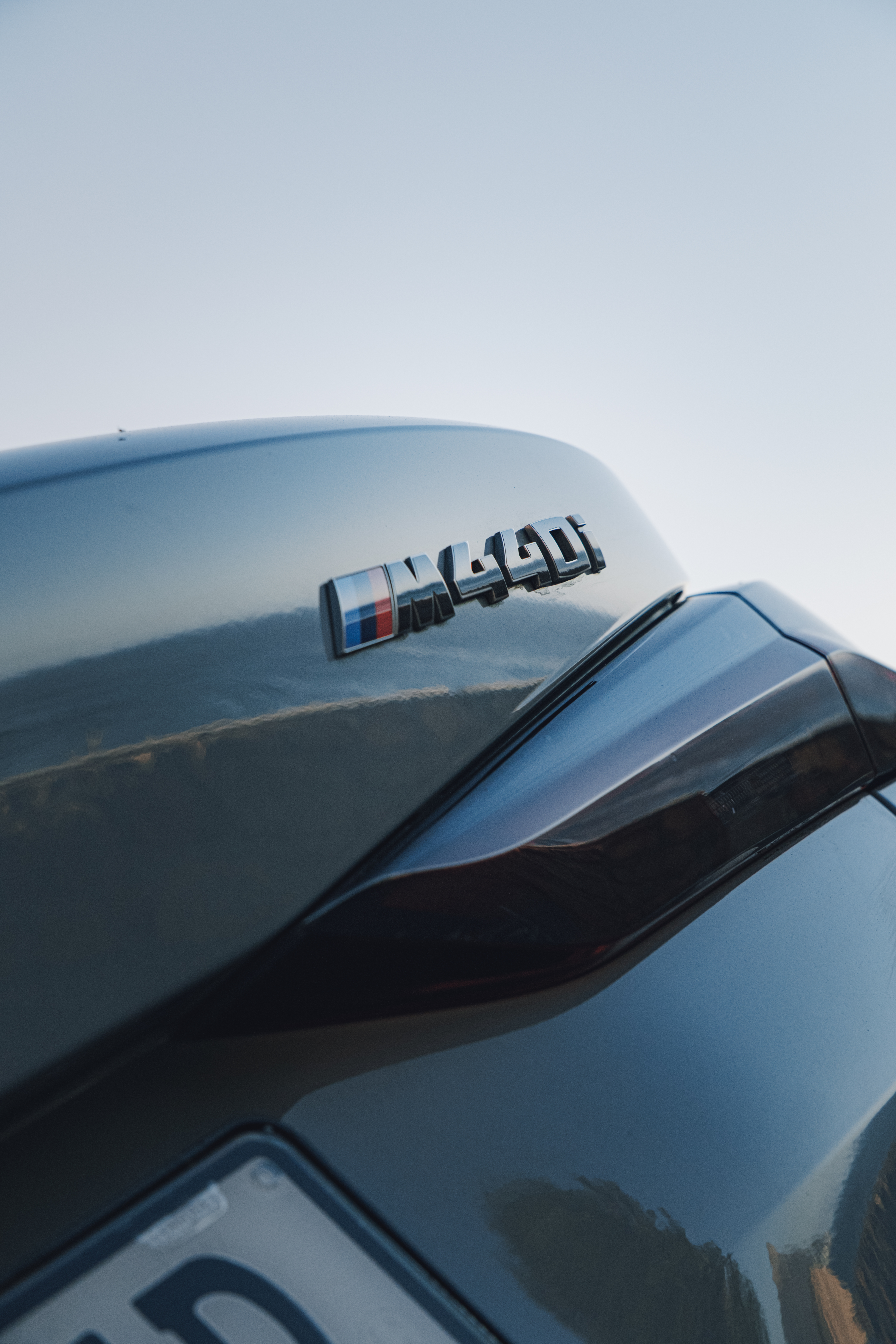 Silver 2024 BMW M440i xDrive Convertible exterior detail.