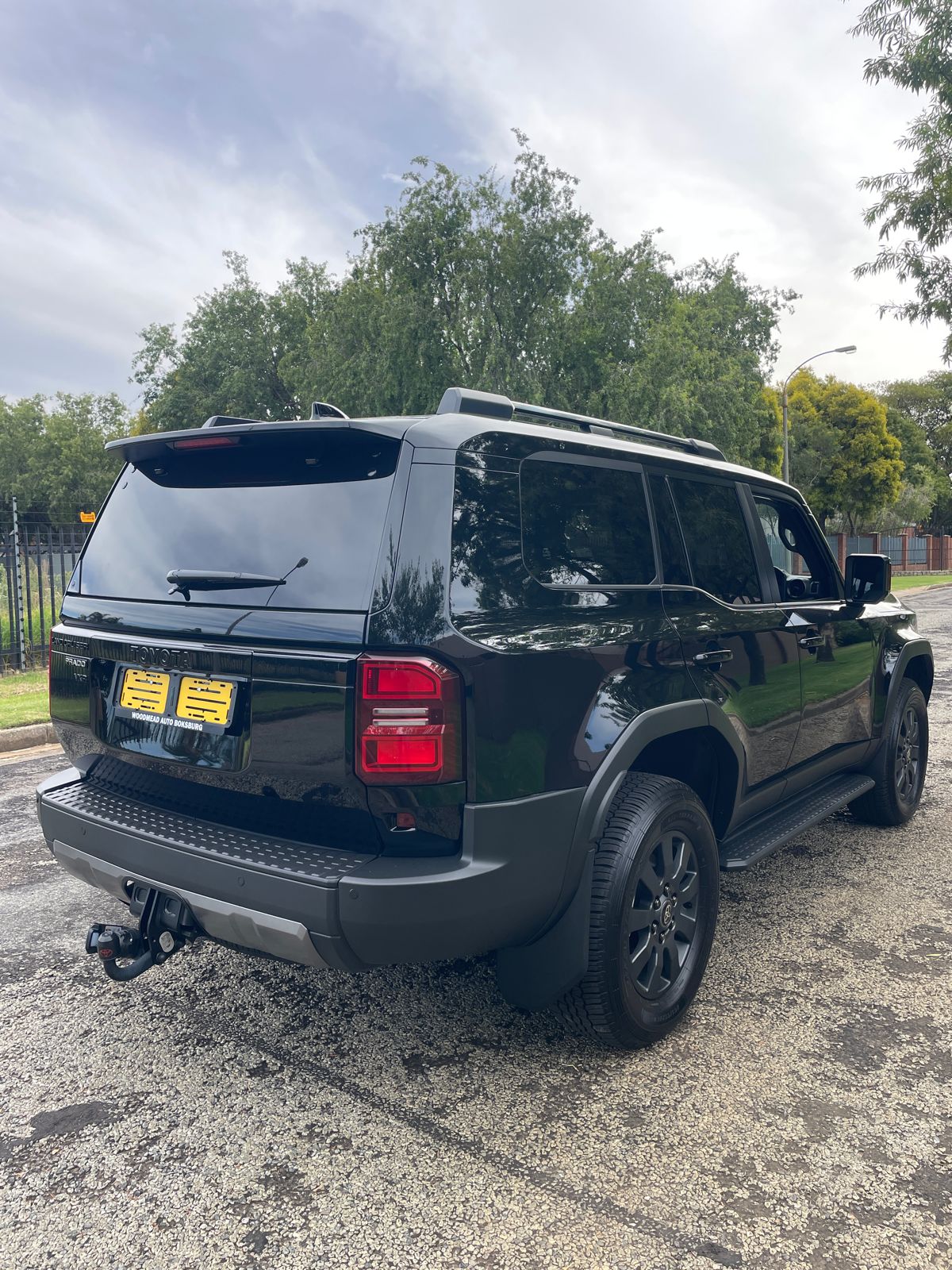 Black 2025 Toyota Land Cruiser Prado VXR side view.