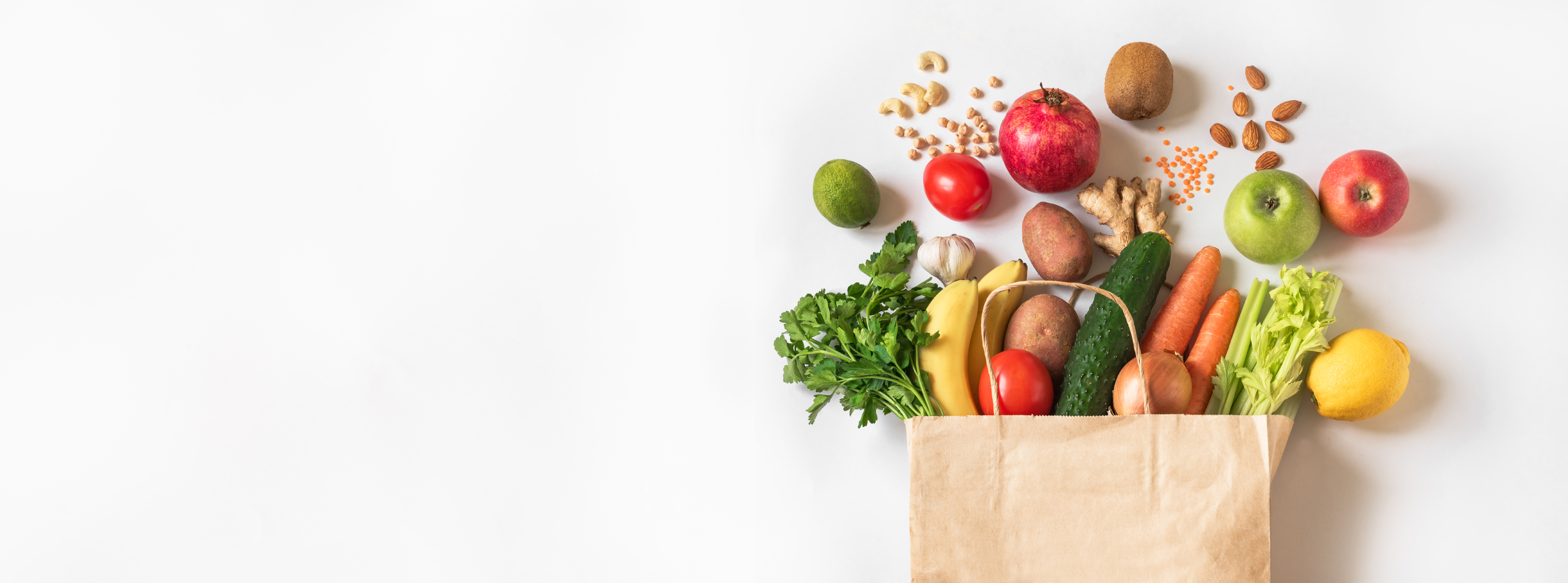 Healthy groceries including apples, bananas, greens, and nuts — essential ingredients for wound healing meals from Royal Wound Care.