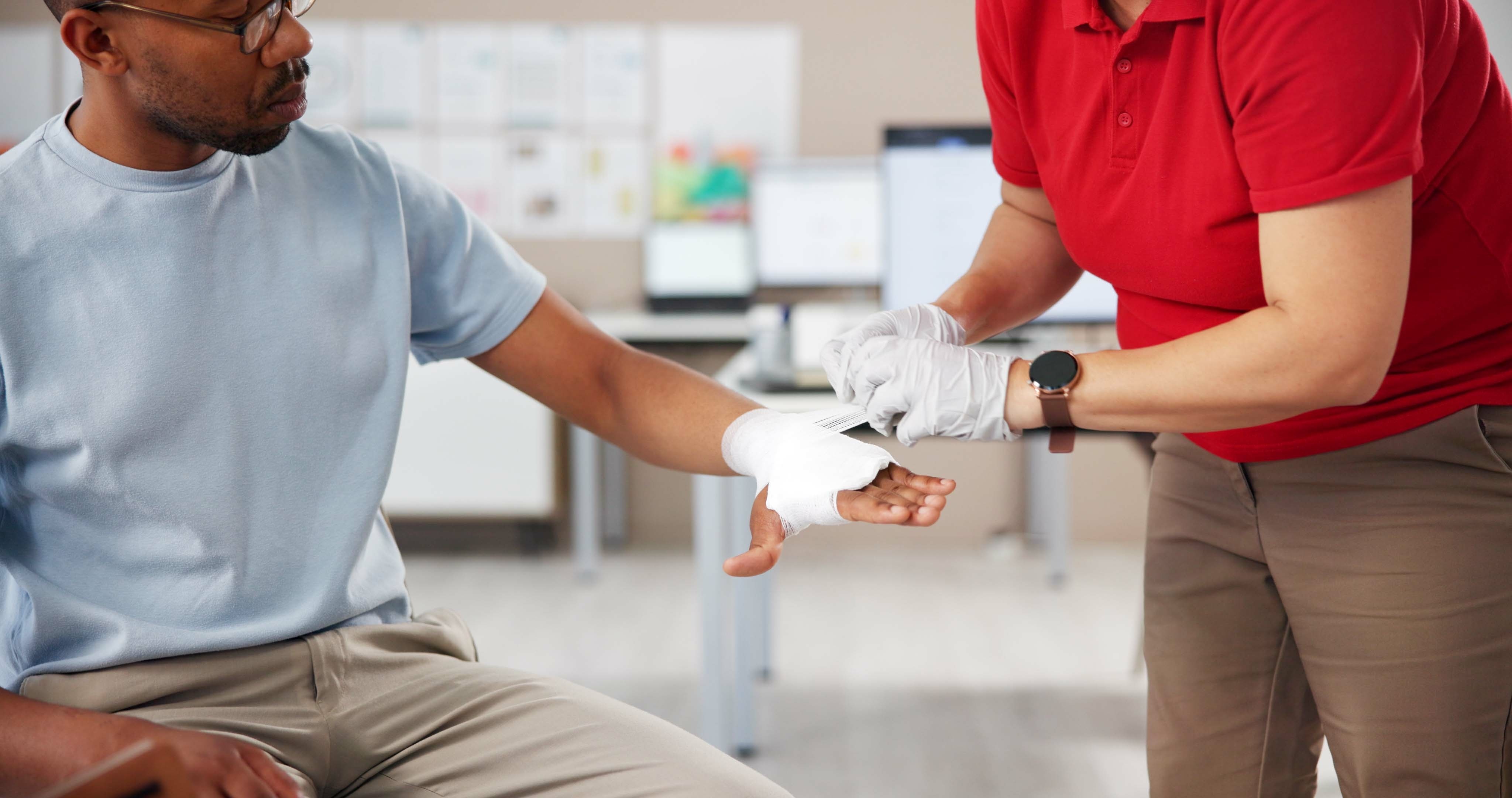 Royal Wound Care specialist bandaging a patient’s hand in a clinical setting for chronic wound management Royal Wound Care specialist bandaging a patient’s hand in a clinical setting for chronic wound management