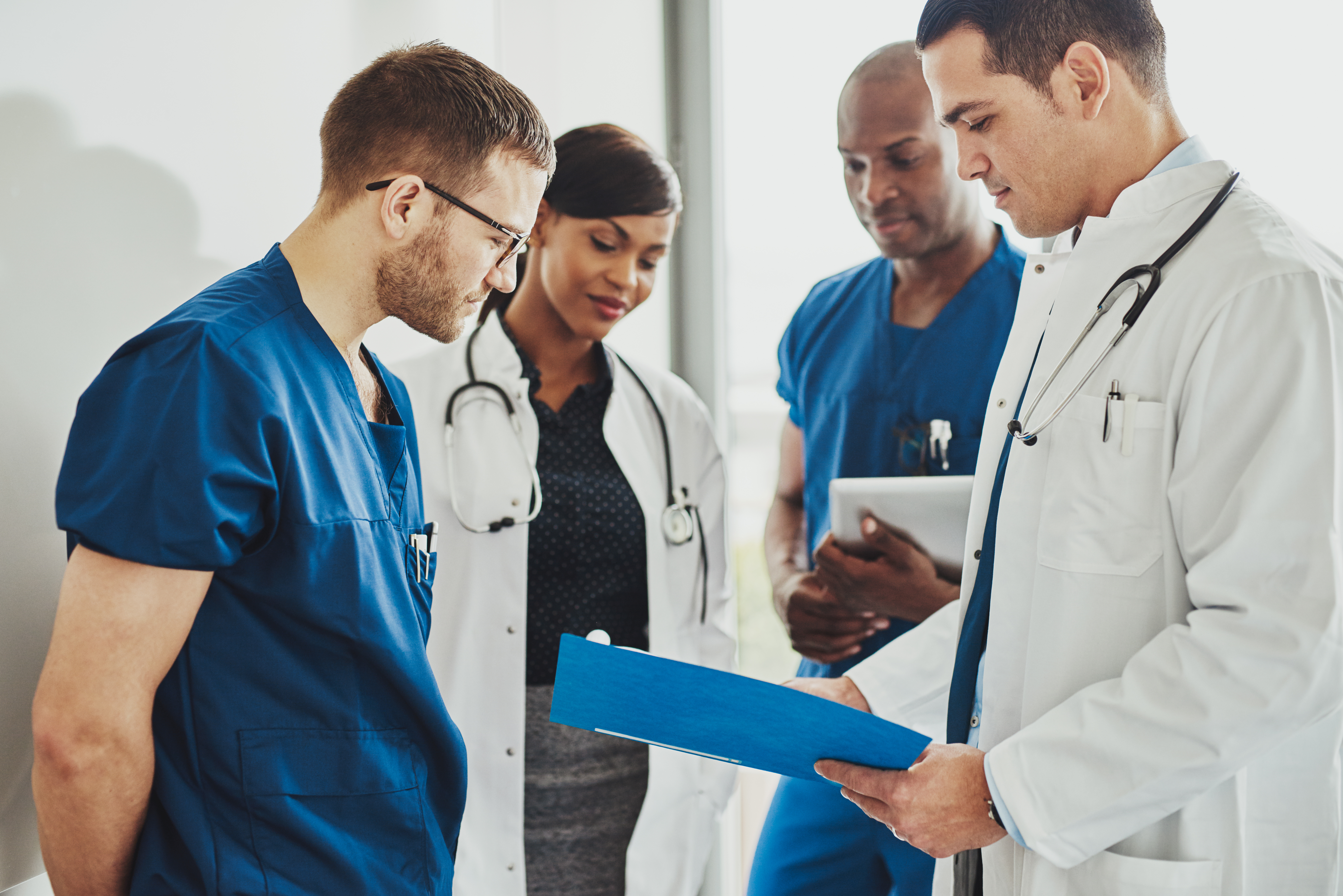 Multidisciplinary team of wound care providers at Royal Wound Care in Los Angeles reviewing patient treatment plans for skilled nursing facilities.