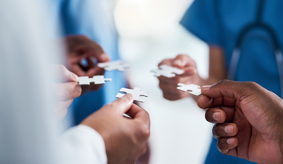 An image of piecing a puzzle together