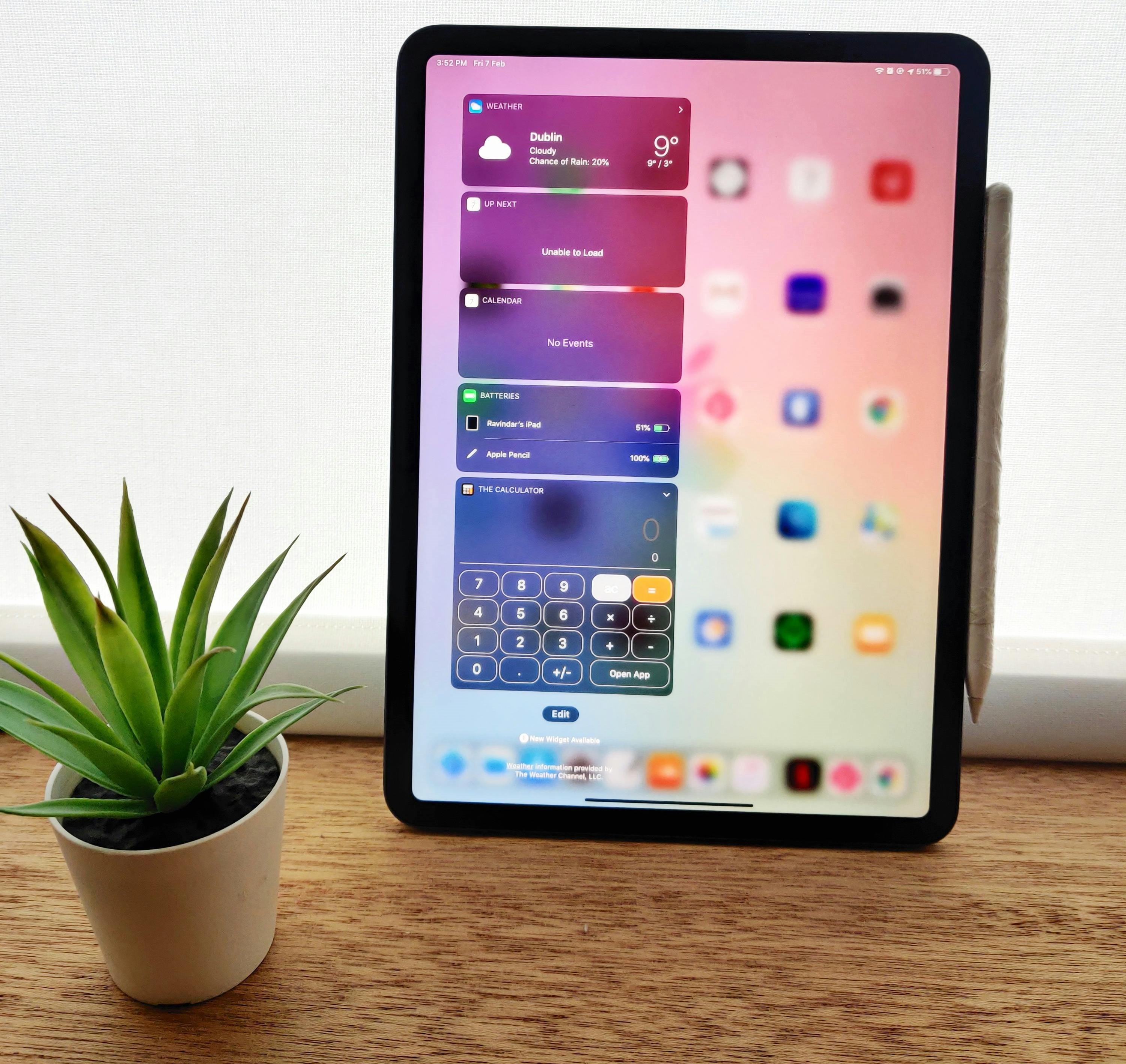 Tablet displaying smart home apps, showcasing energy-efficient technology and home automation for modern living.