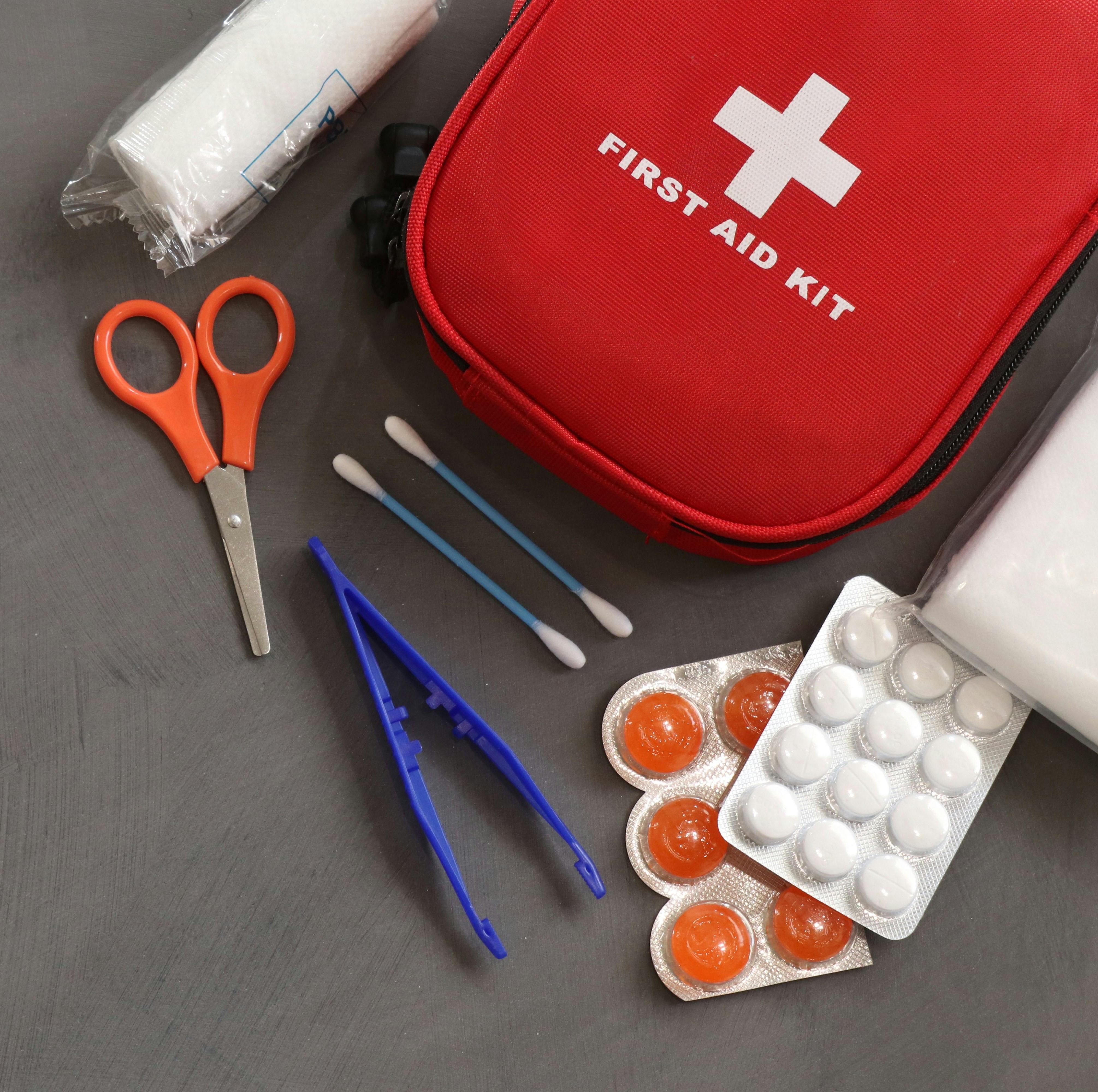 First aid kit with essential emergency supplies, highlighting the importance of preparedness during a power outage.
