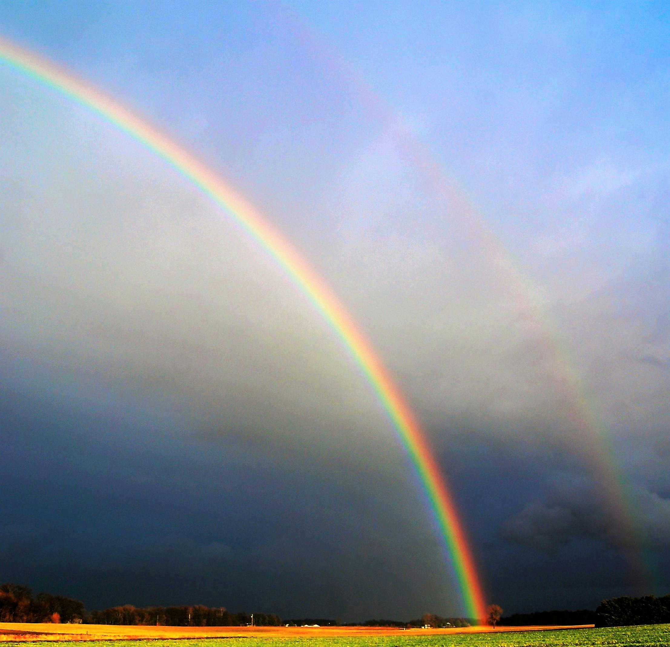 Rainbow appearing after a storm, symbolizing recovery and steps to take after severe weather passes.