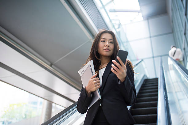 A professional insurance agent on the phone talking to clients.