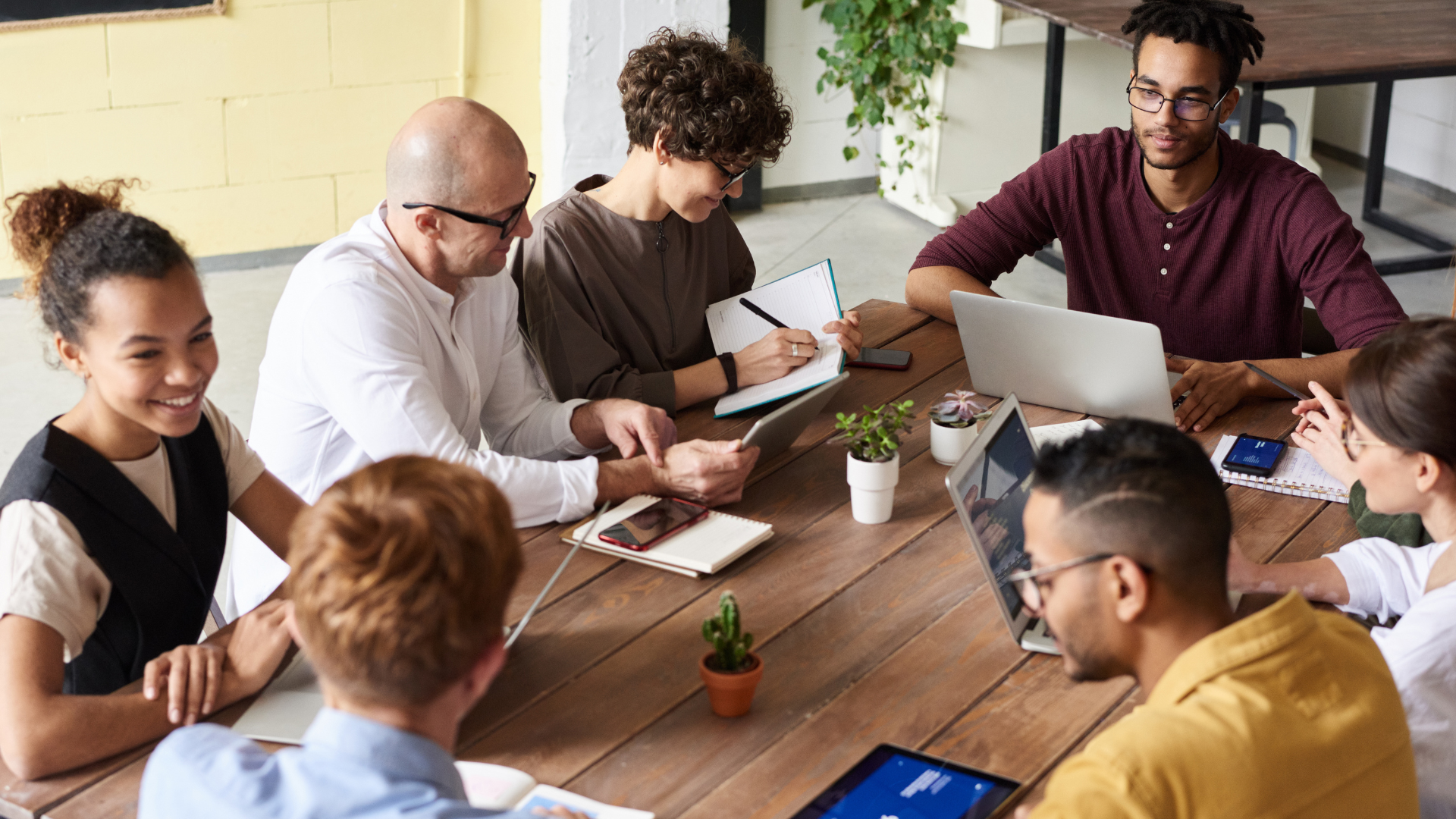 Image of a diverse group of business professionals collaborating in a modern office with a Swiss cityscape view. Represents teamwork, innovation, and professionalism in enhancing the customer journey with Swiss precision Image of a diverse group of business professionals collaborating in a modern office with a Swiss cityscape view. Represents teamwork, innovation, and professionalism in enhancing the customer journey with Swiss precision