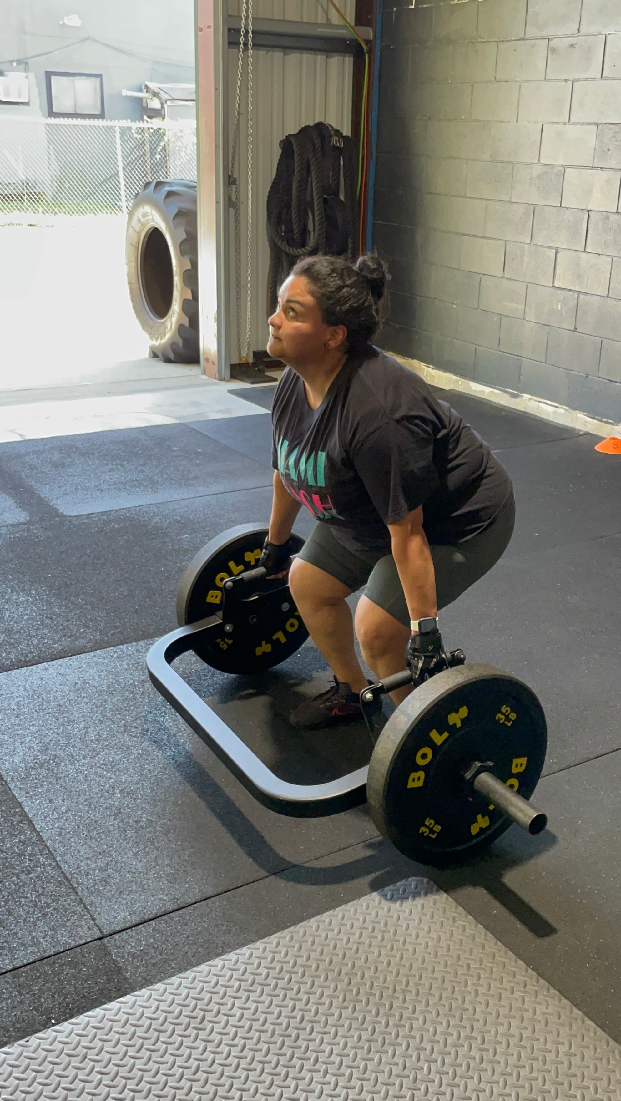 women doing trap bar deadlift strength training