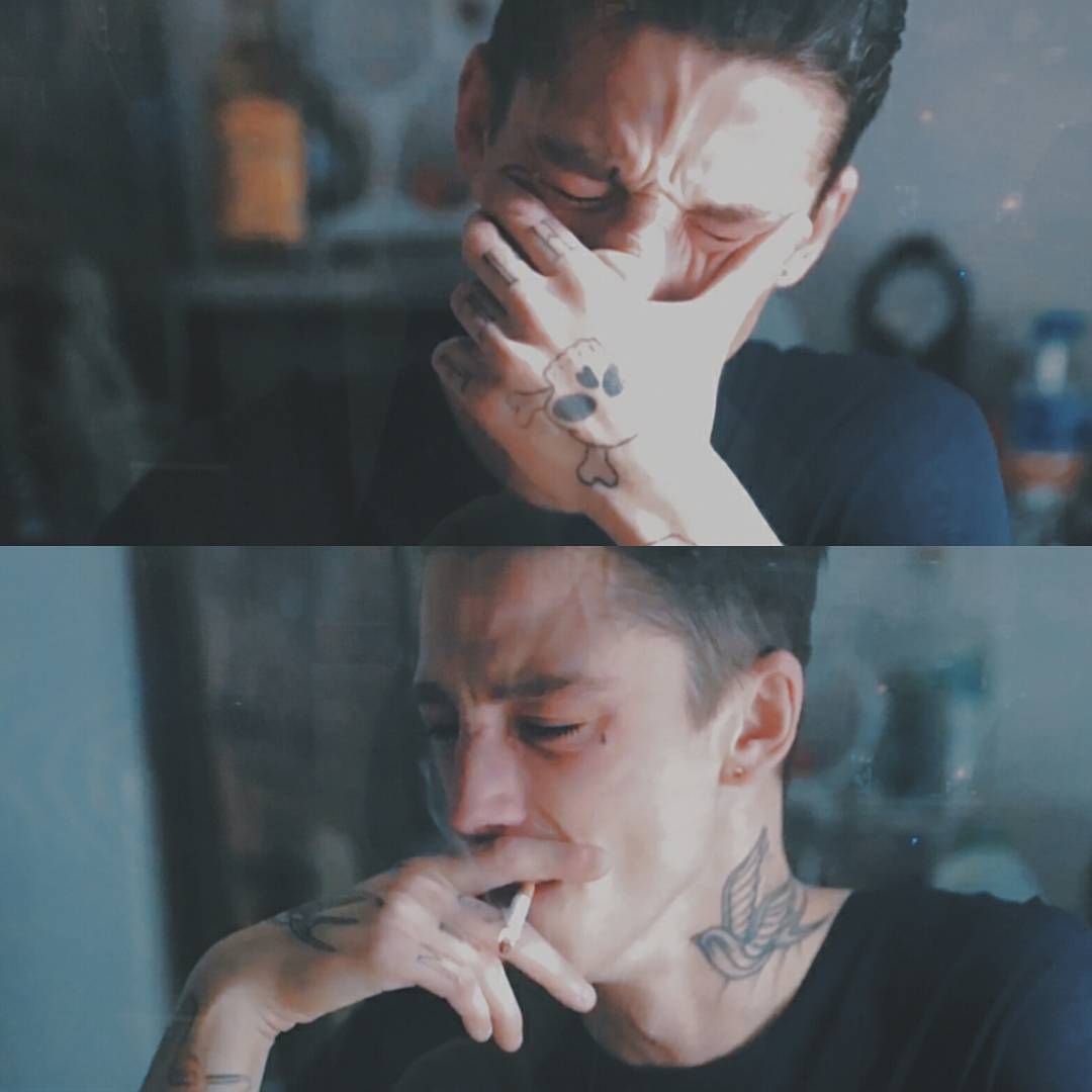 Person Looking Stressed While Holding a Cigarette Person Looking Stressed While Holding a Cigarette