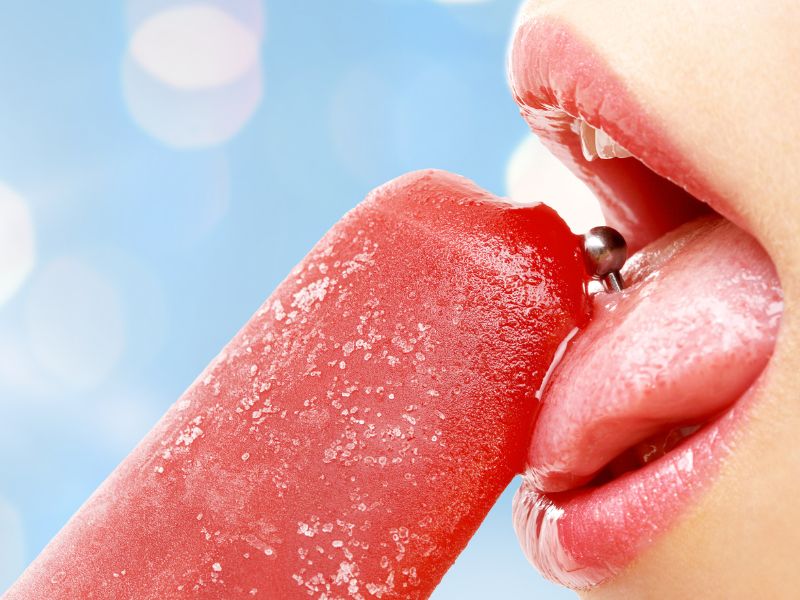 image of woman licking a popsicle