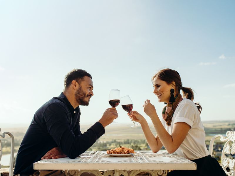 Image of a man and woman on a date smiling Image of a man and woman on a date smiling