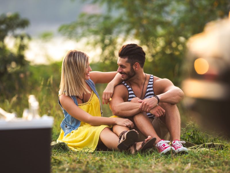 Image of a woman touching a man on a date Image of a woman touching a man on a date