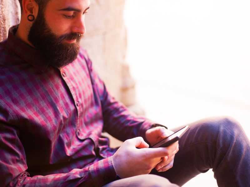 Man texting on his phone