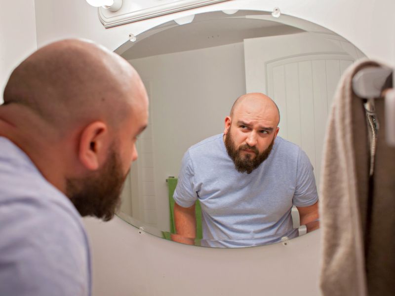 Man looking in the mirror