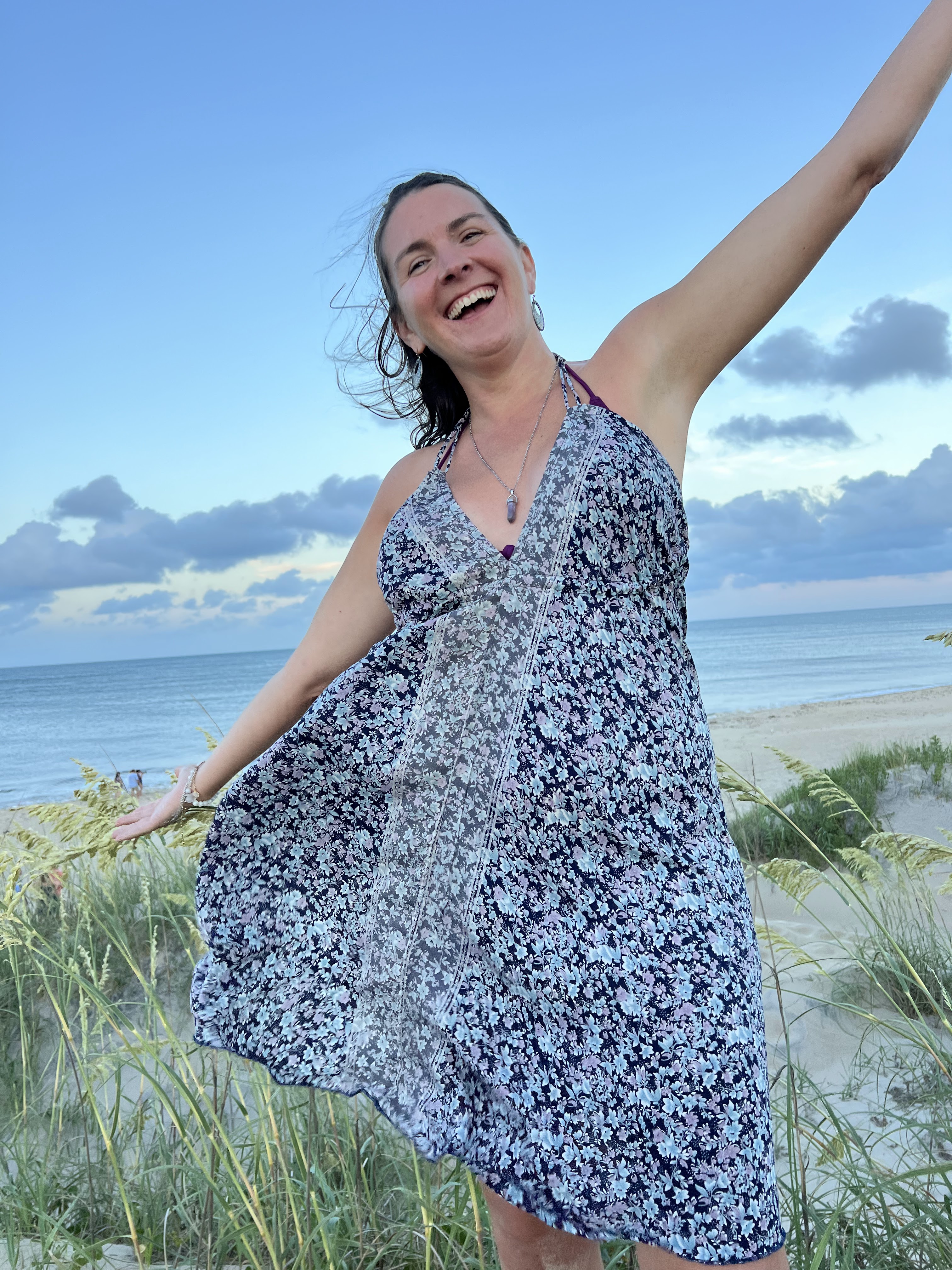 Woman at the beach happy.