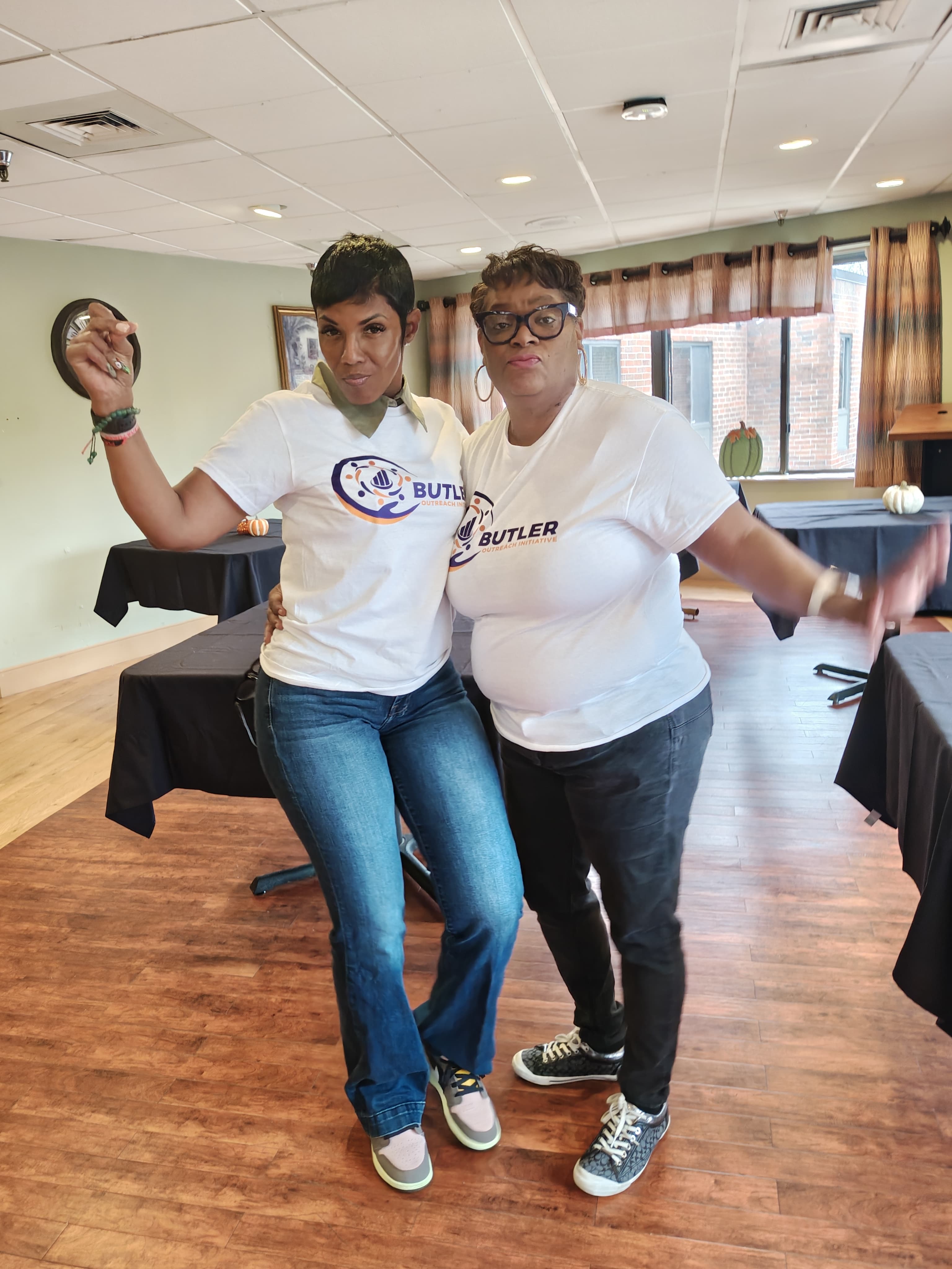 Barbara Butler and a volunteer supporting outreach efforts during a community event